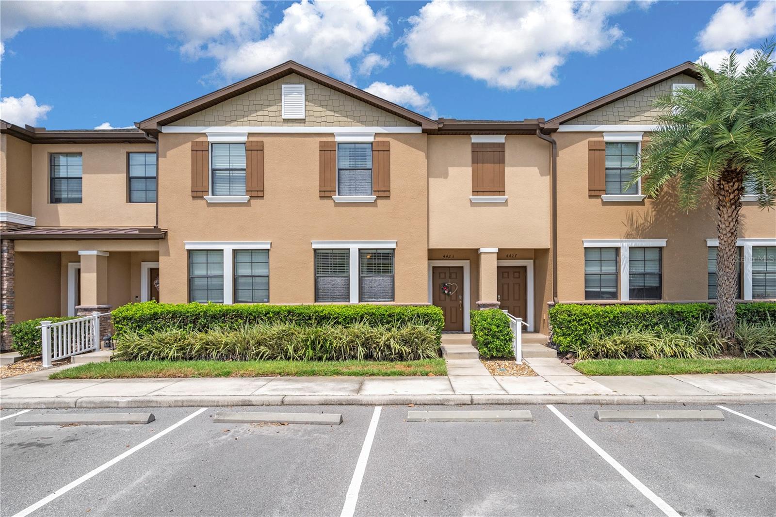 Set within the gated Meadow Pointe North community, this beautifully maintained 3 bedroom, 2.5 bath townhome offers serene pond views, a versatile floor plan, and access to top-tier amenities in one of Wesley Chapel’s most convenient locations. From the moment you arrive, you’ll appreciate the ample parking, sidewalk-lined streets, and mature landscaping, all meticulously maintained by the HOA. Inside, the open-concept layout is designed with entertaining in mind, featuring easy-care tile flooring and elegant crown molding throughout the main living areas. The light-filled living room flows effortlessly into the eat-in kitchen, where you’ll find granite countertops, a 4-piece stainless steel appliance package, breakfast bar seating, pantry storage, and a spacious dinette. A convenient half bathroom serves guests nearby. The primary suite is privately situated on the first floor and offers a peaceful retreat with its own walk-out screened patio, a large walk-in closet, and an ensuite bathroom complete with a granite-topped vanity, upgraded lighting, and a glass-enclosed walk-in shower. Upstairs, two generously sized bedrooms, each with walk-in closets, share a full guest bathroom. A large loft or bonus room adds even more flexibility, perfect for a home office, playroom, or media space. Living here also means enjoying access to the Meadow Pointe IV amenities including a clubhouse, swimming pool, playground, tennis, basketball, and volleyball courts. All of this is just minutes from top-rated schools, dining, shopping, medical facilities, and major roadways for an easy commute into Tampa. Don’t miss this incredible opportunity. Call today to schedule your private showing!