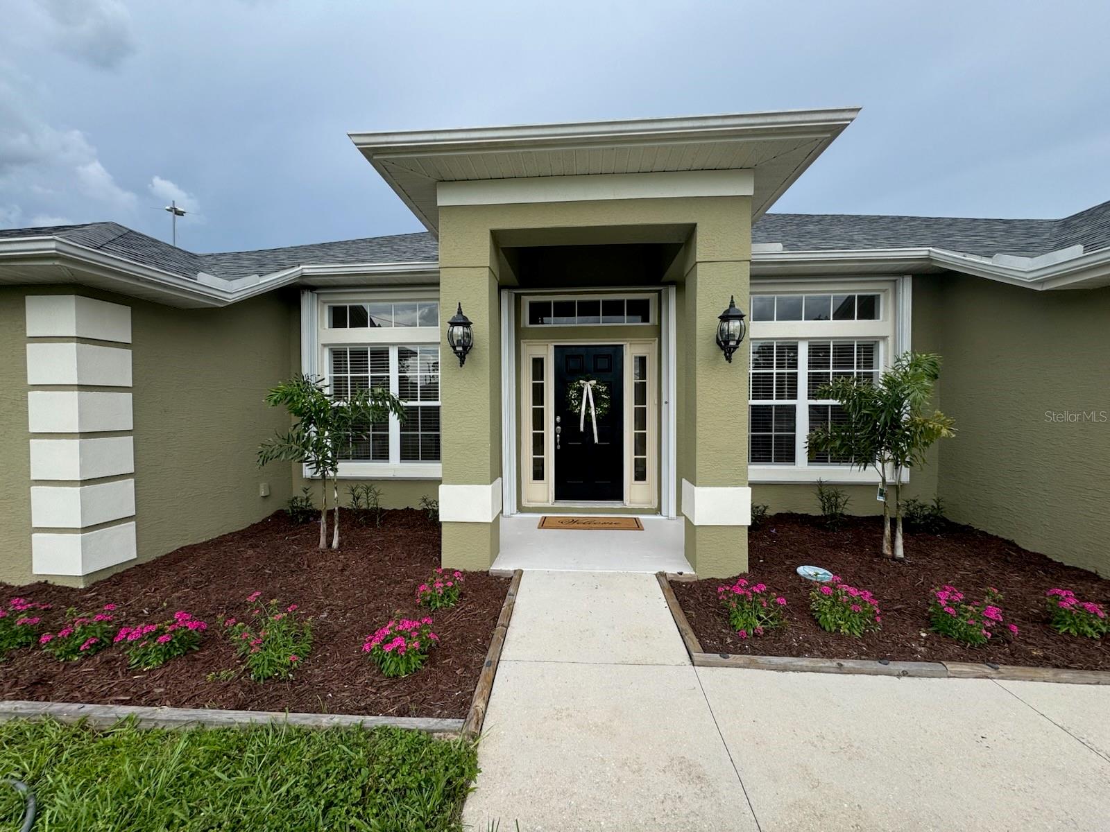 One or more photo(s) has been virtually staged. This beautifully maintained 3-bedroom, 2-bath residence offers over 2000 sq ft of spacious living with thoughtful design and lush outdoor surroundings. Nestled in a serene neighborhood, this home features a formal dining room perfect for entertaining, and an open-concept living room with vaulted ceilings. Enjoy year-round comfort in the Florida room, as well as a bonus room for a home office, gym, or playroom — whatever suits your lifestyle. The master suite is a true retreat, boasting two walk-in closets and a spacious en suite bathroom for added luxury. Don’t miss the opportunity to own this exceptional property that blends space, comfort, and style in every detail. Priced to sell, this gem won't last long! Schedule your private showing today!