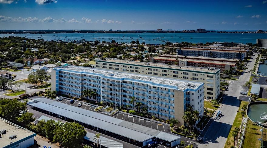 Welcome to Town Shores, Gulfport’s premier 55+ waterfront community! This 2nd floor 1 BR deluxe unit has 1060 htd.sq.ft. Amenities include double insulated impact windows, custom interior plantation shutters throughout, easy-care laminate flooring, a newer HVAC system (2022), updated kitchen and bathroom boasting new cabinets and granite countertops. Recent building upgrades include pool renovation, roof work approximately two years ago, and a new building water heater installed approximately four years ago. The Milestone Report has been completed and passed, ensuring peace of mind for residents. The monthly condo maintenance fee of $752 covers water, sewer, garbage, internet, cable, pool and grounds upkeep, and gas for cooking and hot water. Parking is a breeze with assigned oversized space #49. The laundry room is conveniently located on the same floor, and one of the four Town Shores community pools is right behind the Kenmore Building. Cool off during the summertime & enjoy the heated pool in the winter. Enjoy the vibrant Gulfport lifestyle with local amenities such as the Gulfport Fresh Market every Tuesday, numerous restaurants and pubs, Gulfport Beach, art galleries, the library, Senior Center, Casino dancing, a fishing pier, and the Gulfport recreation center. This is a perfect opportunity to embrace a lively and convenient community! All room measurements are approximate and should be verified by Buyer. No damage to unit during recent hurricanes.