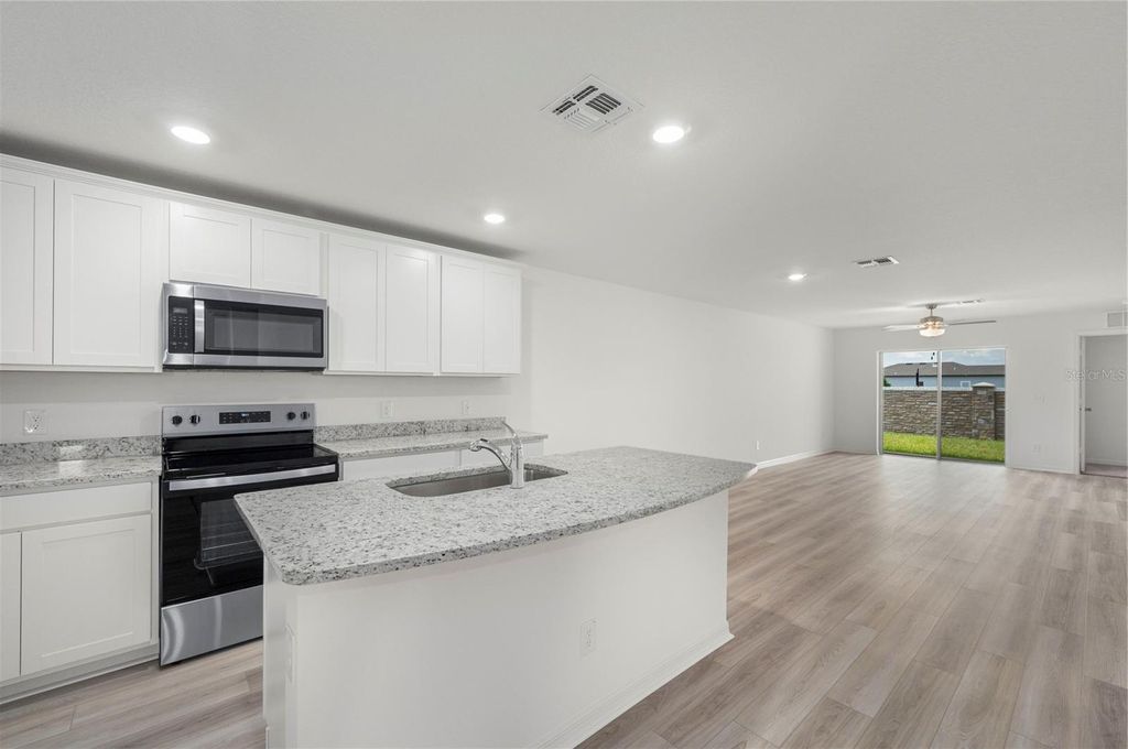 Photo of 3191 Seville Street, Lake Alfred, FL 33850 (MLS # TB8415413)