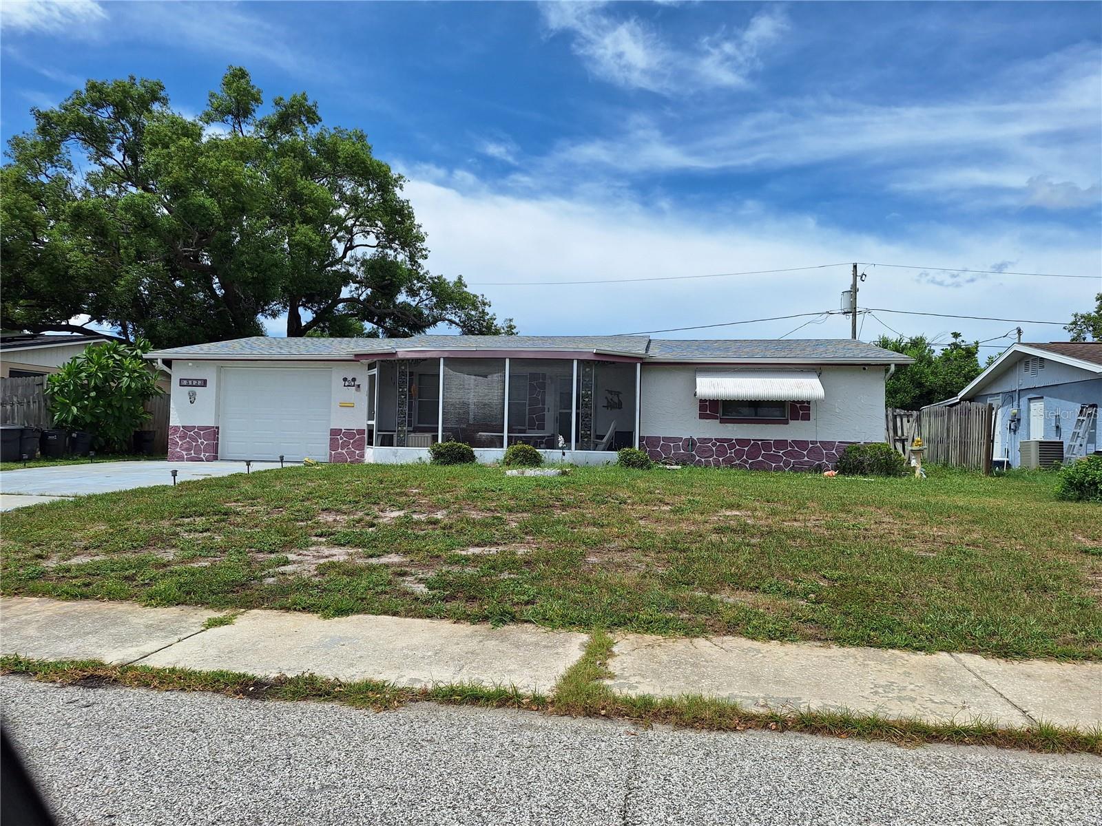Incredible Colonial Hills Fixer Upper!! This 2 Bedroom, 1.5 Bathroom, 1 Car Garage Home has a Big Living
Room and also  a Large Family Room, a Galley Kitchen and Appliances. Fencing in Private Back Yard with a
Shed. The home had a New Roof in 2024, New A/C in 2023, Newer Garage Door, and  Septic System Clean
Out in 2019. Rear Yard has a Mosaic Tile Patio Slab, it was previously an Enclosed Screen Room that was torn
off during Hurricane last Summer. House is in an X Flood Zone, and in area of great schools! Damaged Ceiling in Living Room.  Big Bedrooms and Cedar Closet in one! Tiled Garage Bathroom with Shower and Toilet has Wash Tub just outside bathroom
door. Most all major items have been completed already. Call today to see if you will be the next owner.Â
Come give this home a fresh new interior!