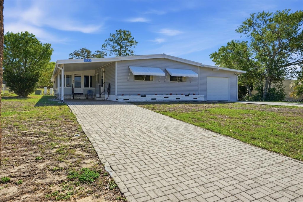 Photo of 8795 Highpoint Boulevard, Brooksville, FL 34613 (MLS # TB8490194)