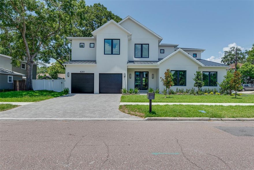 Welcome to your brand new MOVE IN READY executive home by Gloger Construction complete with pool and spa! Rated for A+ schools including Mabry, Coleman, and Plant. This gorgeous Modern Farmhouse home of 4,795sf home offers 5 bedrooms, 5 full and 2 half bathrooms, bonus room and study situated on a 100x100 corner lot. You will be impressed with the features of this new build offering block construction on both the first and second floor, Low E Impact windows, and paver driveway/patio/porch. The open floorplan is perfect for entertaining with a beautiful 22’ entryway. Kitchen offers custom wood cabinetry with soft close doors/drawers, Thermador Appliance package with 48” gas cooktop, fridge, freezer, and wine fridge columns, double wall oven, and dual dishwashers. Quartz counters with island large enough to entertain even the largest of gatherings. Spacious walk-in pantry and mud room add to the upscale convenience. Designer selected light and plumbing fixtures, 10” plank European white oak wood flooring throughout and stylish porcelain tiles in the wet areas. You will love your large master bedroom with oversized walk-in closets and en-suite with dual vanities, freestanding tub, and frameless glass enclosed shower. Two guest suites on the first floor, one with access to the pool area. This home is in the gorgeous Virginia Park, a wonderful neighborhood perfect for walking and biking. Home has received the Certificate of Occupancy and is ready for move in immediately.