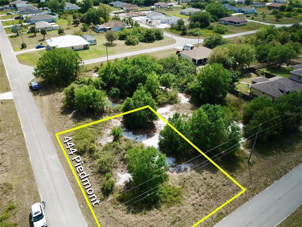 Photo of 444 Piedmont Street, Lehigh Acres, FL 33974 (MLS # O6292498)