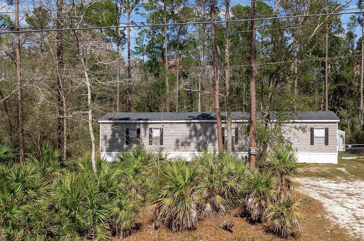 Nestled on 1.1 acres, this charming home offers privacy and space with a fully fenced backyard. The cozy living area flows into a kitchen with a bright breakfast nook. The owner's suite is separate from the guest bedrooms, featuring a spacious bath and a large walk-in closet. Outside, you'll find a carport designed to accommodate an RV, complete with its own electric hookup. Featuring two sheds for ample storage. Plus, enjoy peace of mind with a brand-new drain field installed in 2024.
