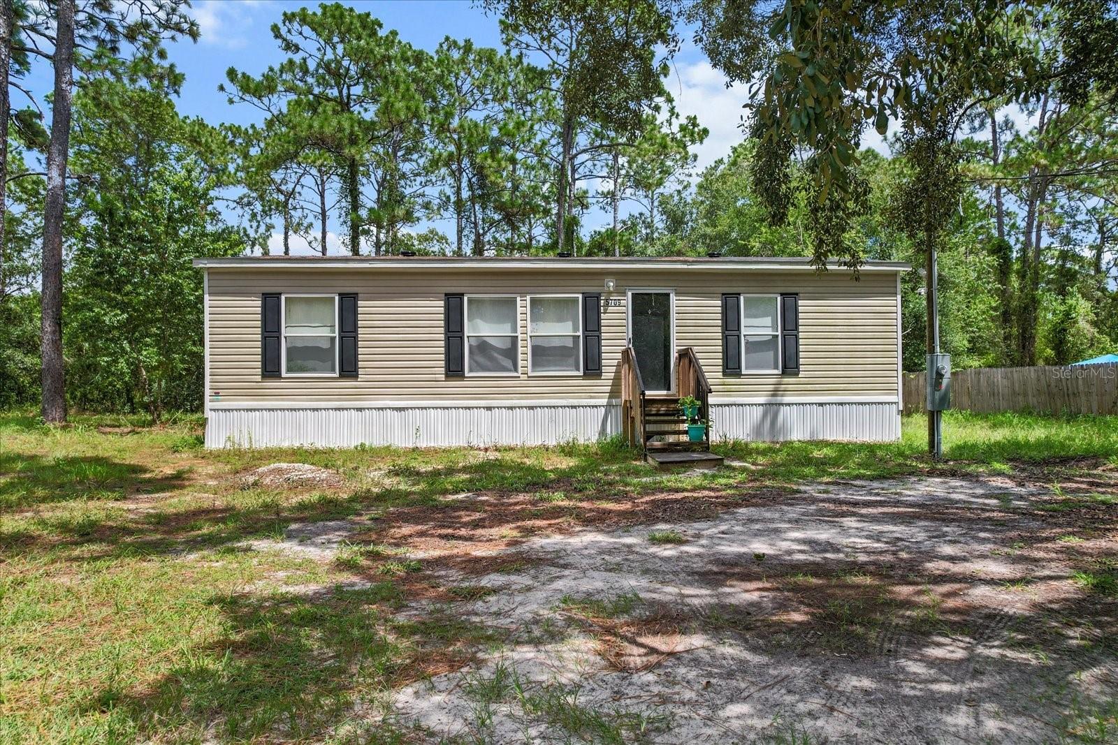 Built in 2023, this 3-bedroom, 2-bath mobile home offers modern living on a spacious .51-acre lot in Homosassa. Inside, you’ll find an open floor plan, contemporary finishes, and plenty of natural light throughout. The generous lot provides room to enjoy the outdoors, add a garden, or create your own backyard retreat. Conveniently located near shopping, Homosassa Springs, and just minutes from the Suncoast Parkway for an easy commute. Whether you’re looking for a full-time residence or a Florida getaway, this property is move-in ready and waiting for you!