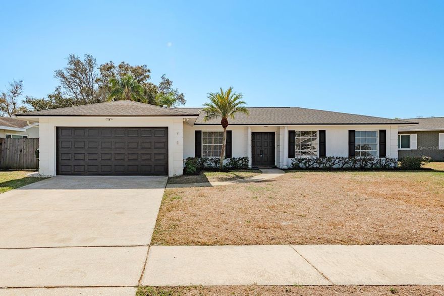 Welcome to Orangewood Estates, a distinguished community in Pinellas County. This well-maintained residence is centrally located in a private neighborhood on a cul-de-sac, offering both tranquility and convenience. The property is just minutes from the Pinellas Trail and the pristine Gulf beaches. Constructed with concrete block by Rutenberg, this home features a versatile floor plan designed for flexible living arrangements. Upon entry, the ranch-style foyer leads to a spacious living room or potential fifth bedroom on the right, and a formal dining area on the left—ideal for entertaining or as a dedicated hobby space.
The split-plan layout provides a private primary suite with an en-suite bathroom and generous closet space on one side of the home. Overlooking the screened in covered porch and inground pool, the kitchen includes an open-concept design with a breakfast bar adjacent to the family room, facilitating seamless interaction. Three additional bedrooms are situated on the west side of the home, each with ample closet space and access to a full bathroom.
Recent updates include fresh interior paint, Porch screens 2025,  a new roof installed in December 2025, luxury vinyl flooring throughout, and modernized kitchen and baths. Additional amenities comprise a fenced backyard for privacy, ideal for pets, off-street parking, a two-car garage for vehicles and storage, and sidewalks for evening walks. Experience the Florida lifestyle in this exceptional home.
Close to beaches, but outside the required flood zone with no HOA—a great option for extended families.