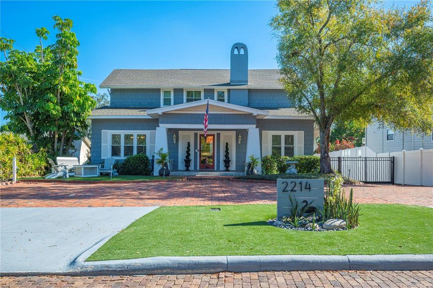 Lake Hollingsworth stately 1920s wood-shake bungalow located just three homes from the lake on the iconic brick-lined Coventry Ave! Offering nearly 4,500 square feet, this one-of-a-kind residence is rich in historic character, featuring ceiling beams, log-cabin pattern oak flooring, arched doorways, a grand staircase, wood-burning fireplace, and rare “icing plaster” detailing on the dining room ceiling. Designed for entertaining, the versatile layout begins with an impressive entry leading to two spacious living rooms, an enclosed porch currently styled as a bar area, and seamless indoor-outdoor living. Enjoy a built-in outdoor grill/kitchenette, expansive Trex deck, sunken hot tub, and a heated swim spa tucked beneath the deck, creating a true private retreat. The kitchen is a showstopper with abundant cabinetry, porcelain countertops, a large island, and a sleek Invisacook induction cooktop integrated directly into the porcelain surface of the island. The entire home is equipped with a whole-house water filtration system, and the kitchen features reverse osmosis drinking water for increased water quality. Upstairs in the original portion of the home are two oversized bedrooms with walk-in closets/dressing areas and an original full bath featuring separate shower and tub stalls, vibrant electric tile, and architectural arches that honor the home’s era. The private primary ensuite, added above the garage and accessed off the kitchen, offers separation from the main living quarters. The ensuite bath connects directly to the outdoor deck, providing a unique indoor-outdoor experience. The 500+ sq. ft. basement suite adds an additional bedroom/bathroom and another layer of versatility to the home—complete with its own exterior entrance, full bath, kitchenette, a cozy living area, and eccentric 6-foot ceilings — perfect for guests to stay or an unforgettable entertaining space. The property is designed as a low-maintenance “zeroscape” oasis with turf and zero grass. Major updates include a 2022 roof, 2025 windows, 2025 water heaters, and HVAC systems from 2022 and 2025. With close proximity to the Lake Hollingsworth walk/bike path, lake views from the front yard, and the timeless charm of Coventry Avenue, this is truly a rare and unforgettable Lakeland home!