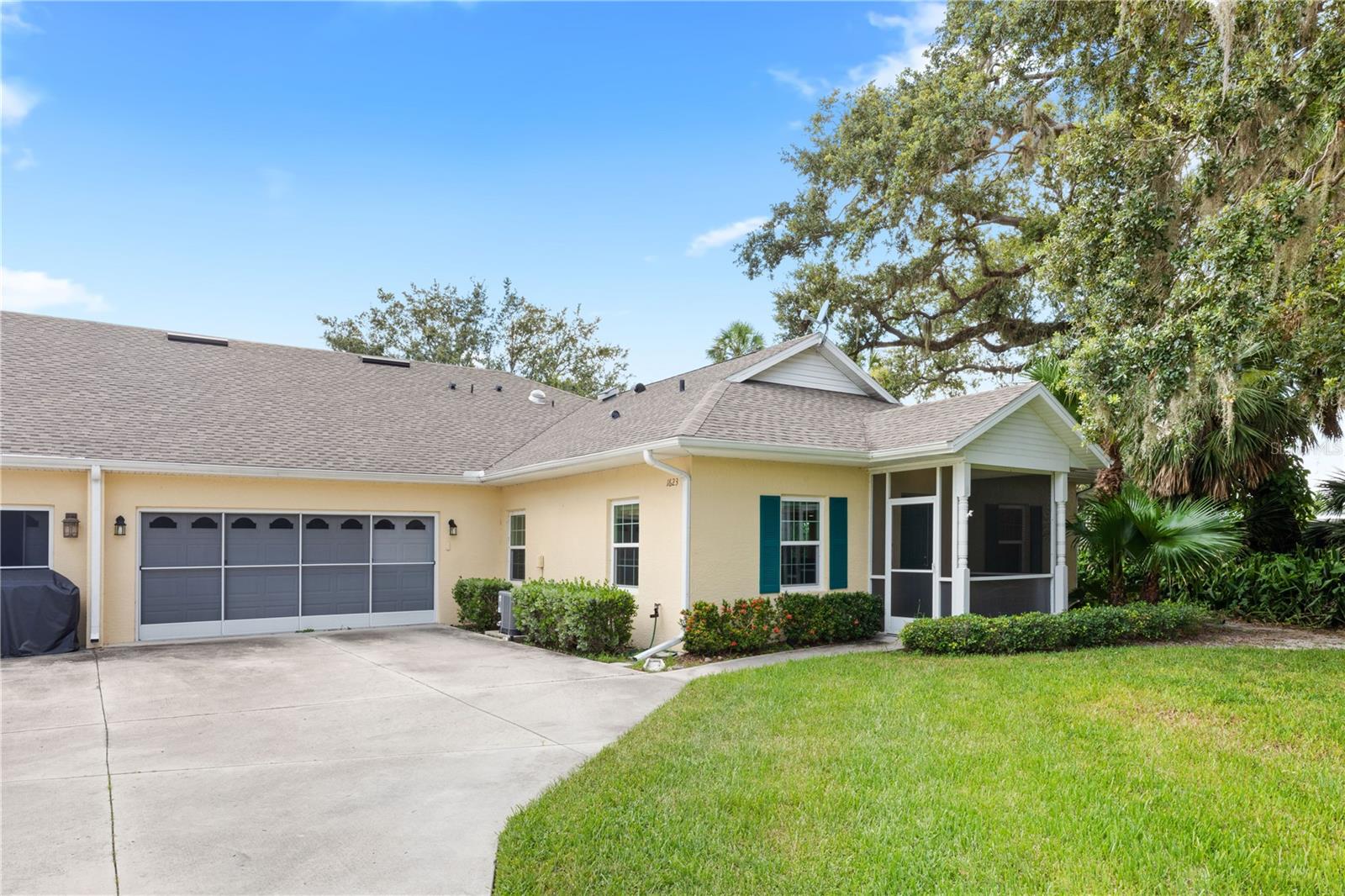 CHARMING 2 Bedroom, 2 Bathroom, 2 Car Garage Villa with a Den located in the highly desirable Heritage Oak Park community in Port Charlotte. NO FLOOD REQUIRED! CLICK ON THE VIRTUAL TOUR LINK 1 FOR THE VIDEO AND VIRTUAL LINK 2 FOR THE 3D TOUR. Spend quality time with friends and family in an open living room with a large dual open glass slider to the lanai for plenty of natural lighting, showcasing a serene park-like view. An EAT-IN kitchen offers ALL white appliances, plenty of cabinets for storage, a closet pantry, and a breakfast bar. The spacious master bedroom has DUAL walk-in closets and an en-suite bathroom with dual sink vanities, a linen closet, and a walk-in shower. The guest bedroom is on a split floor plan, offering plenty of privacy, with a built-in closet and a guest bathroom nearby. A versatile office offers endless possibilities—whether you envision it as a serene home office, a peaceful meditation retreat, a vibrant playroom, or a comfortable 3rd guest bedroom. Extend your living and entertaining space into the screened lanai, where serene landscaped views await. Featuring window panels for effortless conversion into a Florida room, it's the perfect blend of indoor comfort and outdoor charm. 2021 ROOF - HURRICANE IMPACT WINDOWS - LARGE ATTIC STORAGE ABOVE GARGE - DUAL OPEN SLIDER SHADE. Heritage Oak Park is an active & pet-friendly gated community. Amenities include a Clubhouse, heated community pool, tennis, pickleball, bocce ball & shuffleboard courts, horseshoes, a lending library, billiards, a walking path around the lake, and an activities director on staff to keep your social calendar full! Schedule your showing TODAY!