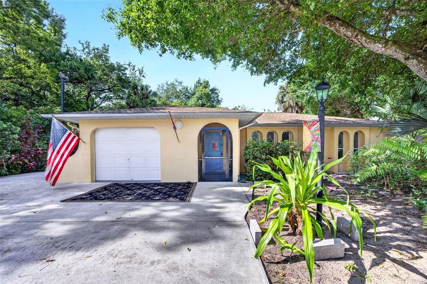 Under contract-accepting backup offers. APPROX HALF-ACRE!! 3 BEDROOM, 2 BATH, AND 1 CAR ATTACHED GARAGE SITUATED ON A FULLY FENCED CORNER LOT OFFERING RARE UTILITY AND STORAGE CAPACITY IN NORTH FORT MYERS. This property is a great choice for a home-based business owner, a hobbyist, or anyone requiring significant space for equipment and vehicles using the two exterior outbuildings. Step inside to a split floor plan featuring neutral tones, classic archways, and laminate flooring in the main living area. The kitchen has white cabinetry, solid surface countertops, a pass-through window, and breakfast bar overlooking the dining area. Generous primary suite offers direct access to lanai, walk-in closet, and an ensuite bath. Split floor plan provides privacy for all with two additional guest bedrooms and guest bathroom. At the back of the home is an enclosed 30x10 lanai with electric providing extra year-round living space. Beyond the enclosed lanai is an oversized lot featuring plenty of privacy and the flexibility to adapt the grounds to your specific needs. One exterior infrastructure is 30x35.  It has two sides, one 30x20, with electric, painted, and carpeted.   The second side is 30x15 also with electric and shelving.  These spaces are perfect for a large workshop or equipment storage. Additionally, an 20x10 shed, with electric, provides extra space for tools, while a carport and one-car garage both offer covered parking. The expansive, fenced yard offers the perfect setup for a landscaping or trade business in need of extra space for equipment. Surrounded by mature shade oak trees, desert roses, staghorn ferns, and Florida fauna that bring the landscape to life. Additional features include new AC system totally redesigned (7/2025) for $20k with a smart thermostat, replaced duct work, and has a transferable warranty, newer roof (2022) including lanai decking, new stainless-steel refrigerator (2026) with an extra refrigerator/freezer also on lanai, and safe in hall closet to convey with property. Great location just 2 blocks from Route 41, a short distance from Pine Island Road and Cape Coral, restaurants, shopping, schools, and 30 minutes to both Ft Myers Airport (RSW) and Punta Gorda Airport (PGD). Don’t miss this opportunity! Call to schedule your private showing today!