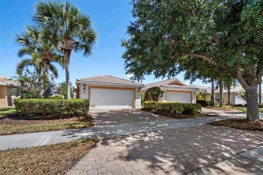 Experience maintenance-free living in The Isles of Sarasota, with sweeping lake and preserve views. This DiVosta-built (poured-concrete) 2-bedroom, 2-bath pool home offers an open, airy floor plan. Upon entering through the leaded-glass front door, the neutral color palette and abundant natural light offer a warm welcome only enhanced by the flexible, timeless layout. The kitchen layout includes a breakfast bar, granite countertops, wood cabinetry and stainless-steel appliances. The primary suite features tranquil pool and lake views, plus an en-suite bath with dual sinks, a walk-in shower, and a spacious walk-in closet. A split-bedroom design provides privacy with a generous guest bedroom and full bath on the opposite side of the home. Stepping onto the covered porch and screened lanai leads to the private pool which overlooks the lake and nature preserve for a relaxing backdrop. Additional features include high ceilings, a large laundry room with granite counters, Whirlpool washer and dryer, utility sink, paver driveway and walkway, and a two-car garage. Residents of The Isles enjoy exceptional amenities including a clubhouse with card room, fitness center, catering kitchen, geothermal-heated pool, playground, bocce, basketball, pickleball, as well as lighted Har-Tru tennis courts. A full-time activities director coordinating a calendar of events adds a meaningful addition to community life. Ideally located in Palmer Ranch near Siesta Key Beach, the Legacy Trail, golf, and outstanding dining and shopping—this is your opportunity to live the quintessential Florida lifestyle.