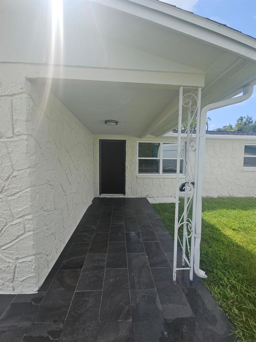 This neat and bright 3-bedroom, 2-bathroom pool home has been tastefully remodeled from top to bottom and is ready for its new owners! Nestled at the end of a quiet cul-de-sac, this home offers style, comfort, and functionality in every corner. Porcelain tile flooring throughout the main living areas, with luxury vinyl plank flooring in the bedrooms. The open-concept living room features a stunning porcelain slab accent wall, creating a modern yet warm focal point. Fully updated kitchen, with matching porcelain slab backsplash, modern cabinetry, and new appliances. (ordered, will be on place by August 20). The garage was previously converted into a master bedroom suit, bringing comfort and space. You'll also love the generously sized laundry room with direct access to the backyard, adding convenience and functionality. Outside, enjoy your private pool, in a big backyard with endless possibilities to create your own paradise. Visit today, don't miss the opportunity to make it yours!!! All measures are approximate and buyer should nor relay on them. Roof replaced on 2020, A/C new 2025.