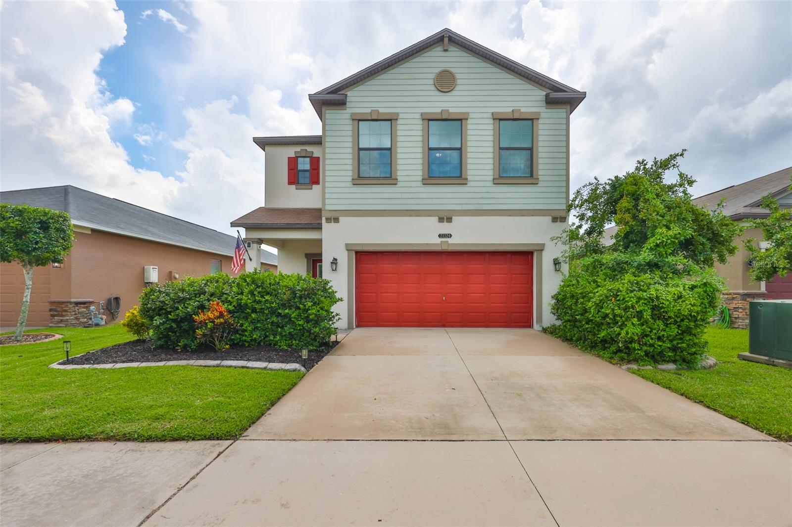 Welcome to 21324 Southern Charm Dr., where everyday living meets resort-style amenities in the sought-after Connerton community. Step through the front door and your eyes are drawn straight to the screened-in patio, private pool, and spa; your private backyard retreat. Just off the entry, the dining space flows seamlessly into the living room and kitchen, making it easy to entertain or simply enjoy daily life. The kitchen is a standout with its large island, pantry, and natural gas stove. A mudroom connects the garage entry to the main living area, and a convenient half bath completes the downstairs. Upstairs, you'll find three bedrooms plus a dedicated office with a striking barn-door entry. The primary suite feels like a true retreat with a spacious walk-in closet, dual-sink vanity, and a beautifully renovated walk-in shower that is part of a full bathroom remodel completed in 2024. Two guest bedrooms and the laundry room are also upstairs for convenience, and all bedrooms feature brand new carpet.
Woodwork accents in the living room and along the staircase add a touch of modern farmhouse charm. Outside, the fully fenced yard is ready for pets, play, and poolside lounging. Living in Connerton means more than just a beautiful home. You'll have access to a resort-style community pool, tennis courts, fitness center, playgrounds, walking trails, and sidewalks that weave throughout the neighborhood. All of this is just minutes from everything Land O' Lakes has to offer.