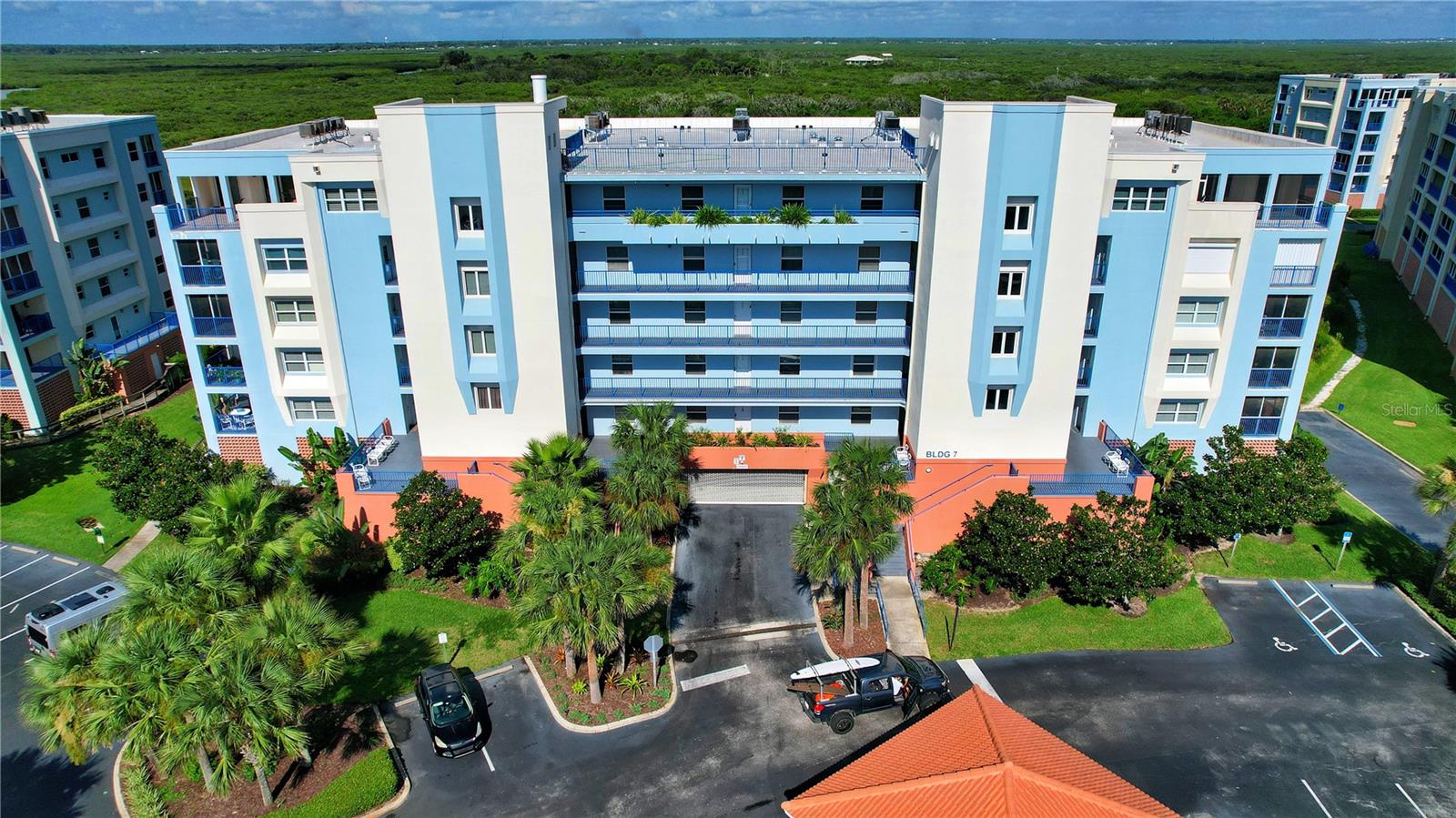 Welcome to your serene slice of paradise in the highly desirable Ocean Walk Complex! This beautifully appointed fully furnished 3-bedroom, 2-bath condo offers breathtaking views of protected Florida estuary and marshland, all just a short walk or golf cart ride to the beach. Designed with a spacious open-concept layout, the living, dining, and kitchen areas flow seamlessly together, creating an inviting space that's perfect for entertaining or relaxing after a day in the sun.
The split-bedroom floor plan ensures privacy, with the primary suite featuring a sitting area, private access to the lanai, sunset views, a walk-in closet, and a luxurious en-suite bath with double vanities, a soaking tub, and a separate shower.
Enjoy year-round comfort with a newer A/C system and peace of mind with ample storage, including inside laundry and a private storage unit perfect for beach gear. The private screened porch and large balcony offers a tranquil setting to unwind or entertain while overlooking the nature trail and estuary. Short-term rentals allowed – Excellent income potential!! Ocean Walk is a premier resort development boasting unmatched amenities, including two gated entrances, clubhouses, pools, spas, a sauna, fitness center, tennis courts, shuffleboard, bocce ball, nature trails, under-building parking, and storage. New Smyrna Beach is also acknowledged as one of the top 100 art towns in America, adding to its appeal as a vibrant and culturally rich community. Now is your time to Live your best life in this stunning beachside beauty. Call us today, as this home will not last long. While all information provided is intended to be accurate, measurements should be verified by potential buyers. Buyers should check city zoning for rental restrictions and do their own due diligence regarding systems and utilities