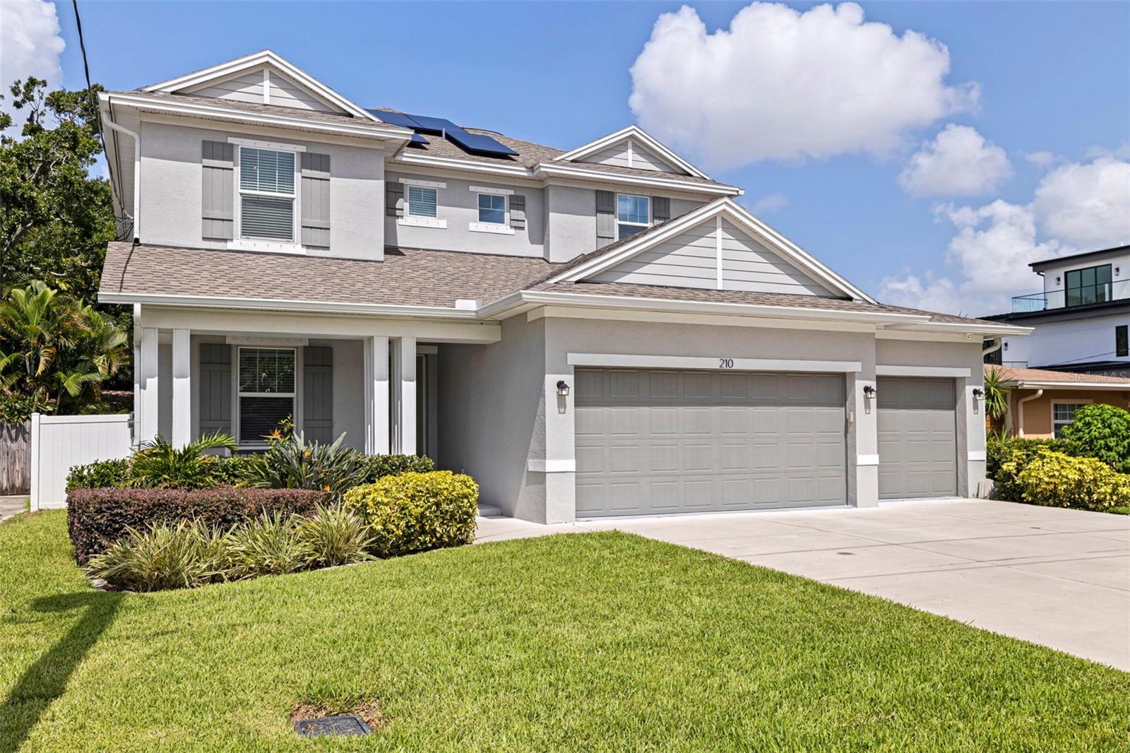 Located within the coveted A-rated school zones of Mitchell Elementary, Wilson Middle, and Plant High School, 210 N. Gunlock Ave is a stunning 2021-built Domain Home perfectly situated in the heart of South Tampa’s charming Oakford Park neighborhood. This thoughtfully designed home blends spacious modern living with timeless style and unbeatable convenience.
Step inside to discover soaring 10-foot ceilings, abundant natural light, and a seamless open-concept layout ideal for both entertaining and everyday life. The chef’s kitchen is the heart of the home, featuring stainless steel appliances, sleek cabinetry, a large island with breakfast bar seating, and ample counter space.
Durable tile flooring runs throughout the main floor, where you’ll also find a spacious bedroom and a versatile bonus room—perfect for a home office, playroom, or guest suite. Upstairs, a bright second living area offers flexibility for a media room or quiet retreat. The expansive primary suite is a true sanctuary with an oversized walk-in closet and a luxurious spa-style bath including a soaking tub, oversized shower, and dual vanities. Two additional bedrooms and a convenient upstairs laundry room complete the upper level.
Step outside to your private backyard oasis, featuring a covered lanai and custom outdoor kitchen, a sparkling resurfaced pool, and a new privacy fence—all completed in 2022. The deep 125-foot lot is one of the larger lots in Oakford Park and includes tropical landscaping supported by an underground irrigation system.
Enjoy peace of mind with paid-off solar panels that provide net-zero energy consumption, hurricane-impact windows and doors, a three-car garage, Yamaha surround sound system, and a full home security setup with cameras. The property is not in a flood zone, had zero issues during the 2024 hurricane season, and has no HOA or CDD fees.
Just minutes from Midtown Tampa, Hyde Park Village, Downtown Tampa, Tampa International Airport, and Raymond James Stadium, this location offers the best of urban convenience with the warmth of a true neighborhood community. With its friendly neighborhood vibe, walkable streets, and active neighborhood events, Oakford Park remains one of South Tampa’s hidden gems.
Homes like this are rare—schedule your private showing today and experience style, function, and location all in one turnkey home!