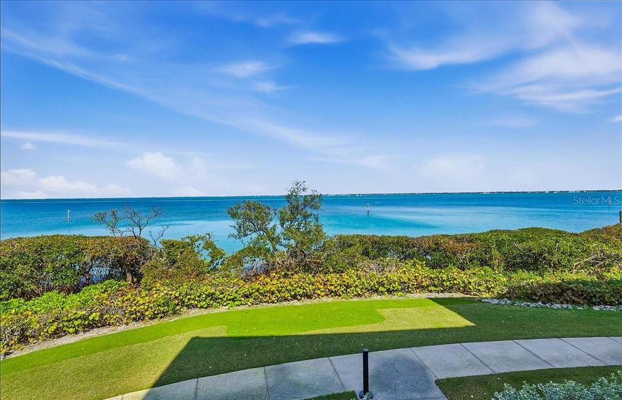 Positioned as the southern-most community on Longboat Keys’ Gulf of Mexico Drive is the stunning Tangerine Bay.  Its presence of pristinely manicured tropical color admired by all that enter the Key.  Within this gated community lies #515- horizontal to Sarasota’s bayfront experiencing views that span across blue waters abundant with active sea-life.  This 2bd/Den/2.5bath/2-car private garage home extends over 2,300 square feet of living space.  Courtyard entry, equipped with gas hook-up for your own grill, offers slider access into the kitchen/ family room area which is perfect for a different entertaining perspective since the courtyard is large enough to also accommodate table and chairs.  Of course, the coveted place to dwell will be the grand living/ dining area and balcony to experience morning sun over the calming waters or the miracle of all the hues the sky can offer as the sun begins to set behind you.  Large primary en-suite enjoys the water view and slider access to the balcony, considerably sized walk-in closet and super-spacious bathroom to create the spa-like atmosphere of your dreams.  #515 will not disappoint with the generous kitchen, kitchen water filtration, split floorplan, updated windows and doors, 2024 roll-down hurricane shutters, 2023 A/C, 2026 water heater, roof and sprinkler heads replaced approx. three years ago.  With a spanning lap pool, meandering lush lounging areas, spa, fishing/day dock, tennis/ pickleball, fitness center and clubhouse- Tangerine Bay is poised for pleasure to all who get to call it home.  For a small annual fee, owners can also become members of the Bay Isles Beach Club.