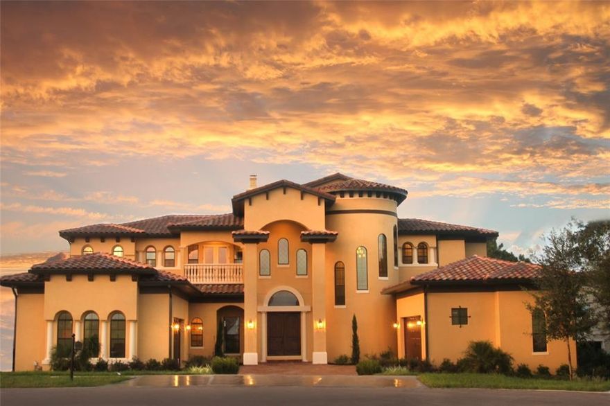 Capture and enjoy Florida Life in this custom lakefront home in the quaint waterski development of “Isles of Lake Hancock” 
This 6-bedroom, 7-bath custom built home has deeded 110’ lake access with a private, covered boat dock and was built in 2015 and at the end of a cul-de-sac giving less traffic and a peaceful feel. It was intentionally built to capture the incredible lake views from every room in this gorgeous and spacious home. It is in the pristine gated community of Isles of Lake Hancock in the growing town of Winter Garden. 
Feel like royalty everyday returning to this magnificent 2-story home! The entrance has dual, split 2-car garages with oversized dual front entry doors and upon entry, the breath-taking view of Lake Hancock will astound you. Inside there is a nice foyer for welcoming guests and open floor plan so all rooms are filled with natural light. The formal living and dining room have wall to wall windows and a gas or wood burning fireplace on a chilly evening. There are custom ceiling features, giving these rooms a luxurious, high-end appeal. The pocket sliding doors open fully to provide unhindered outdoor access. There is an area for a piano cradled in the curve of the sweeping staircase, along with a gated wine cellar and full bath for convenience. 
A spacious and modern kitchen with lots of cabinet space, Quartz countertops and GE Monogram appliances. Feel like a chef when cooking in this kitchen with a huge walk-through pantry; part of the pantry has a built-in elevator shaft which can be easily modified. Just off the kitchen is the laundry room and mud room with garage access. The laundry room has a large sink and a floor mop tub.
The kitchen overlooks a dinette area and the family room. The sliders in this area are pocket doors with remote control blinds. There is a bonus room, currently used as a games room, with a built-in bar with a sink and pool deck access with remote blinds. There is a storage cupboard adjacent and bathroom.
The bedrooms are split with a master suite and office downstairs and 4-bedrooms upstairs. The master suite has a seating area overlooking the lake, bar area, and access to the pool deck. The master bath has split dual sink vanities, a custom shower with 2 shower heads. There are 2-walk-in closets. The bedrooms upstairs have private baths. 1-bedroom is currently converted to a movie room with surround sound and balcony access leading to an open-air sun deck. The upstairs has a front-facing balcony, a bonus room, and a “mechanical” room.
The pool area has a spa, freeform pool, and fountain features. Spa and pool have LED lights and an app for operation of pool / spa lighting and temperature controls. Outdoor kitchen that has a hooded gas grill system, sink, mini fridge. There is a seating area with a pergola. 
Make your own private lakefront beach!  The boat dock has a boat lift and 2 slots with jet ski lifts. The spectacular views of the lake and nightly fireworks are simply amazing.
This neighborhood is known for water skiing, so you can catch ski shows right in your community throughout the year. From your covered boat dock, you can launch your boat to practice your own moves or enjoy a peaceful cruise around the lake. The local Hamlin area is growing with new restaurants and businesses opening every day. There is a planned access dock so you can drive up for some food, fun and sun. Enjoy a short boat ride, dock up, enjoy a meal and return home all without the use of a car.