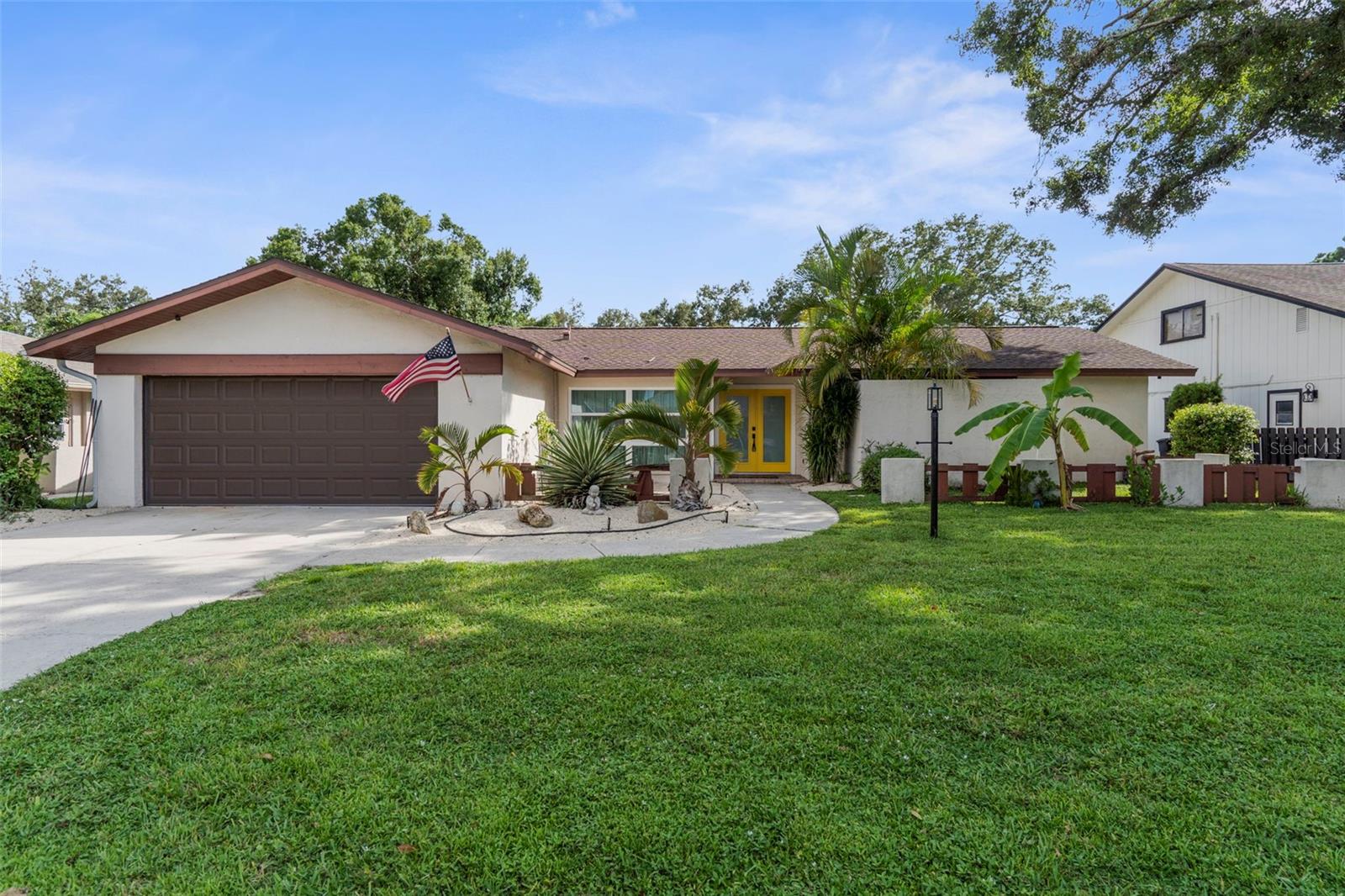 For Rent! Unfurnished Annual Rental! Dog Friendly! This beautiful 3-bedroom, 2-bathroom home in Sarasota offers character, comfort, and charm in a desirable family-friendly neighborhood. With a split floor plan, abundant natural light, and a thoughtfully designed living space, this home is perfect for those seeking a blend of style and functionality. Step into the spacious family room, where a dramatic floor-to-ceiling fireplace serves as the centerpiece, flanked by built-in bookcases and highlighted by a soaring beamed ceiling. The adjoining chef's kitchen has storage galore! Imagine how easy the holidays will be with a double 36" oven! The kitchen overlooks the family room, making it easy to stay connected while preparing meals for entertaining guests. The primary suite features a unique atrium that fills the space with natural light and a private ensuite bath. Two additional bedrooms and a full bathroom are positioned on the opposite side of the home for maximum privacy with a shared bathroom in the hallway. Outside, you’ll fall in love with the expansive oversized screened lanai with brick pavers, the perfect spot for year-round outdoor living. A fully fenced backyard offers plenty of room for young ones, pets, or gardening. Appliances included with the home. Up to 2 dogs permitted under 25lbs each. Lawn care included with rent!