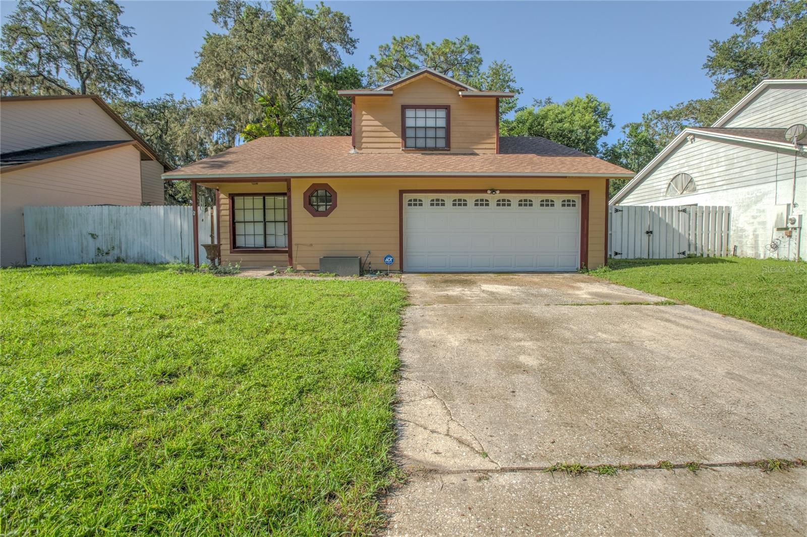 Welcome to this maintained 3-bedroom, 2-bathroom two-story home just minutes from UCF! Featuring a spacious 2-car garage and a thoughtfully designed layout, this home offers both comfort and convenience. The upgraded kitchen boasts stylish cabinetry, ample storage, and a functional layout perfect for everyday living and entertaining. The primary bedroom is conveniently located on the first floor, offering added privacy and ease of access. Upstairs, you’ll find generously sized bedrooms and a full bathroom. New roof, a/c, and hot water heater in 2023. Enjoy outdoor living with a private backyard space, ideal for relaxing or hosting. Conveniently located near shopping, dining, and major highways, this home offers easy access to everything East Orlando has to enjoy. Don’t miss the opportunity to own this charming home near UCF!