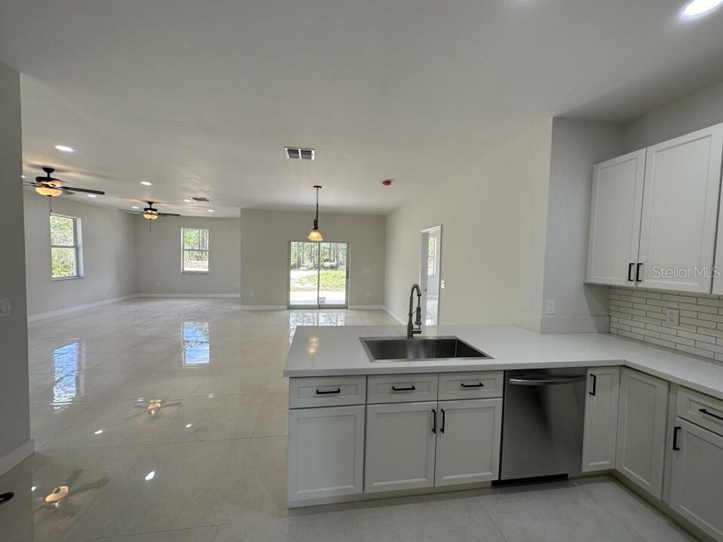 Photo of 3431 Orchid Drive, Indian Lake Estates, FL 33855 (MLS # O6319180)