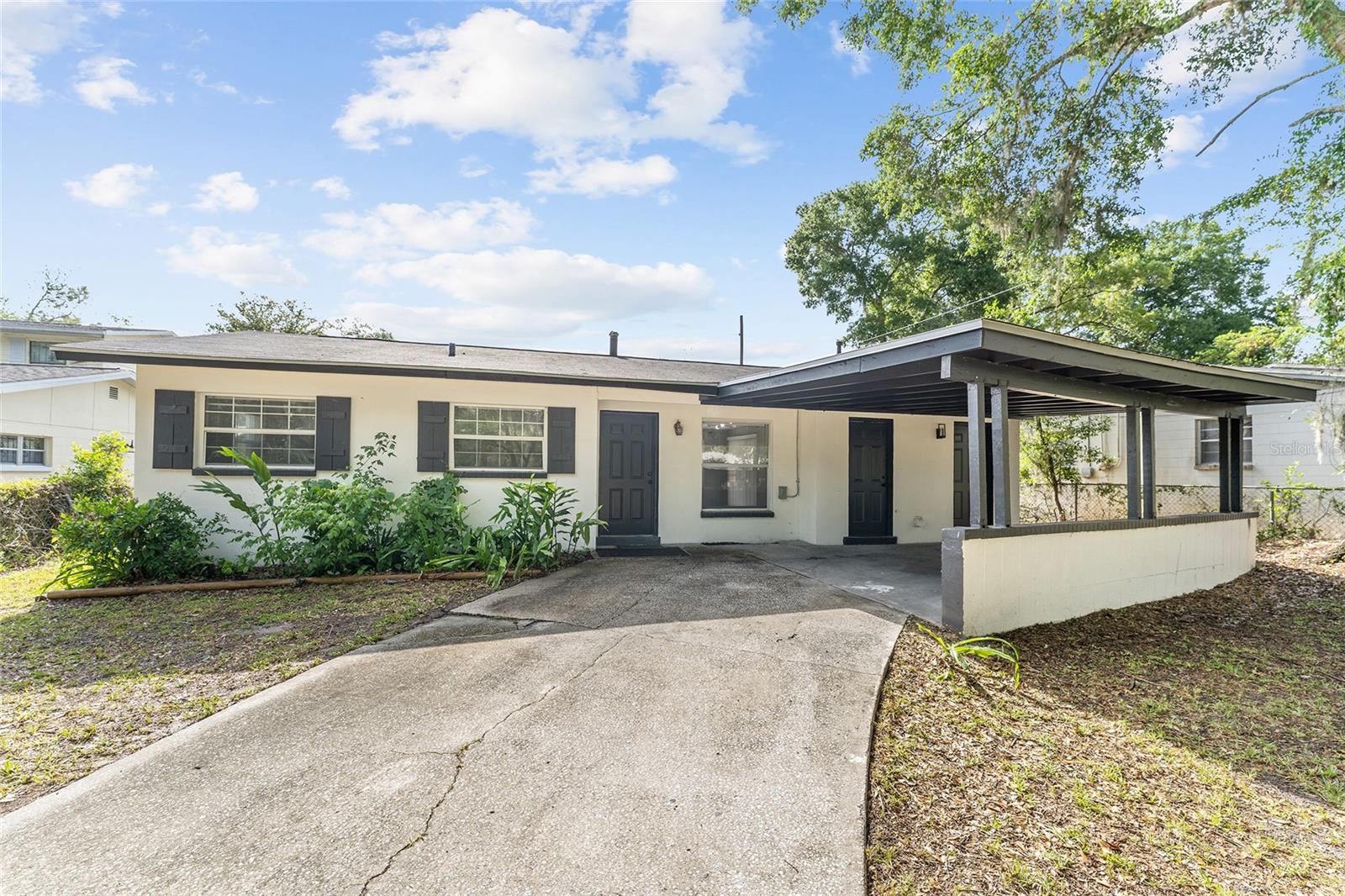 Welcome to this beautifully upgraded 3 bedroom 1 bathroom home in the community of Lincoln Estates. This home offers the perfect blend of comfort, privacy, and convenience. Step inside to discover a thoughtfully designed layout featuring a spacious living room perfect for both relaxation and entertaining. This block stucco home features many upgrades, including a new roof, new HVAC, new water heater, interior and exterior paint, and a fully remodeled kitchen and bathroom. The master bedroom features a walk-in closet and a fully remodeled bathroom. A laundry room off the kitchen. Enjoy the screened-in patio with a fully fenced backyard oasis with ample room for outdoor dining, play, and relaxing. This home has a covered carport with front door and kitchen exterior door access. With its serene location, abundant space, and versatile layout, this home is a rare find in Gainesville. Don’t miss the opportunity to make it yours. Excellent neighborhood in a great school district, conveniently located near hospitals, highways, and shopping centers.