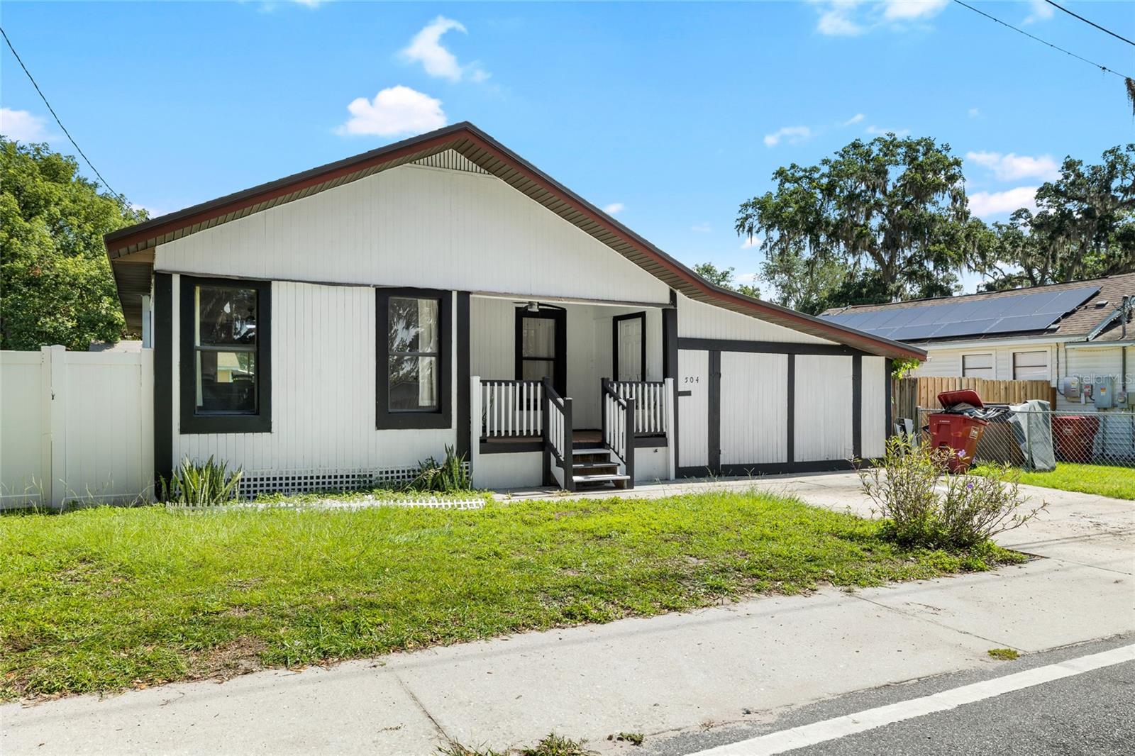 Charming and move-in ready, this beautifully updated home is located in the heart of Plant City's Historic District. Featuring 2 bedrooms, 2 bathrooms, and a 1-car garage with enclosed storage, this home offers both character and functionality. The open-concept living and kitchen area is perfect for entertaining, with ceramic tile flooring throughout, white shaker cabinets, butcher block countertops, a sleek tile backsplash, stainless steel appliances, and bar seating. Just off the kitchen, the dining area flows seamlessly out the back sliding doors onto a wooden deck, making it ideal for indoor-outdoor living. Both bathrooms have been tastefully renovated, and the fenced-in backyard provides a private retreat. The garage/storage space opens on both sides, offering versatile use for a workshop, gym, or additional storage. Major updates include a new roof (2022) and HVAC system (2021) for peace of mind. Don’t miss your chance to own a piece of history with modern updates — schedule your private showing today!