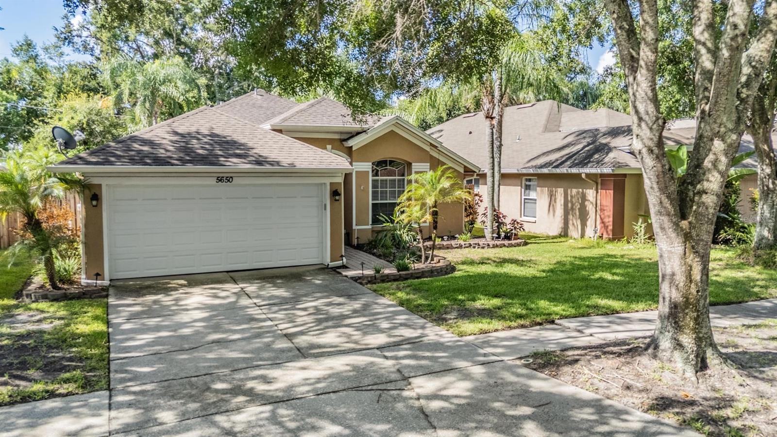 Welcome to Paddock Trails—where comfort meets Florida living. This 3-bedroom, 2-bathroom pool home with a heated spa and 2-car garage has just been freshly painted inside and is ready for you to move right in. Step inside to find a flexible front living room—perfect for an office, game room, or cozy lounge—before flowing into the open kitchen and family room. The kitchen is the heart of the home, featuring granite countertops, stainless steel appliances, a large island, and plenty of space for a dining table. It overlooks the family room, making it ideal for hosting friends or enjoying quiet nights in.
Sliding doors lead to a covered patio and your private screened pool and spa—perfect for year-round relaxation. The main living areas feature ceramic tile, while all bedrooms have laminate flooring. Bedrooms 2 and 3 are tucked off the kitchen, with Bedroom 2 offering a walk-in closet. The primary suite sits at the rear of the home, complete with a spacious walk-in closet, double sinks with granite countertops, and a walk-in shower.
Recent updates give you peace of mind: all appliances replaced in 2019, pool pump replaced in 2022/2023, NEW DE filter grids installed June 2024, air handler replaced 2022/2023, front door, garage entry door, and sliding door replaced in 2019, plus a newer roof. The yard was recently resodded, and new blinds have been installed throughout.
With a LOW HOA fee and a location close to shopping, dining, and the Veterans Expressway, you can enjoy both convenience and your own private escape.
IT'S NOT JUST A HOME--BUT A LIFESTYLE!