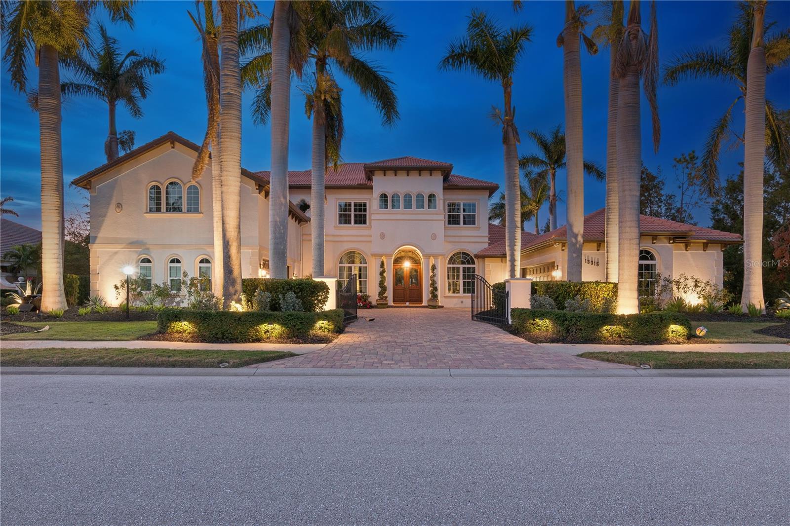 Exquisite Lakefront Estate in The Country Club at Lakewood Ranch~ A Spectacular Family Home ~
Over 6100 Sq ft of space to live, entertain, play and relax.
A bespoke luxury estate in one of the most private enclaves in Lakewood Ranch Country Club. Tucked away on a private ½-acre cul-de-sac lot, this masterpiece is a stunning blend of elegance and modern sophistication, from every room, offering breathtaking lake and nature views that create an unparalleled sense of tranquility.
Step inside to a bright, airy space, high ceilings, and an open floor plan that seamlessly integrates gracious living and grand entertaining. From the moment you enter, walls of impact glass sliders invite you to experience the seamless connection between indoor and outdoor living, where the enclosed resort-style pool, spa, tropical oasis and lake serve as the breathtaking backdrop.
This home was designed and appointed for the discerning buyer. ~
1st Floor :
Living Room with Fireplace * Separate Dining Room * Gourmet Chef’s Kitchen with Subzero and Viking appliances, a breakfast bar, a spacious dining area, large island * Family Room * Billiard Room * Office * Owner’s suite with spa inspired bath and two walk in closets * Laundry Room * Powder Room * Custom Millwork~
2nd Floor:
Bonus Office * Bedroom 2 with ensuite bath * Bedrooms 3 and 4 with Jack and Jill bath * Theatre Room * Game/Great Room with a large balcony that looks out over the pool and expansive sanctuary.~
Outdoors:
Pebble Tec pool with spa and fountain *multiple seating areas * conversation area with fireplace * outdoor kitchen with bar * Professional Lighting *Lavish Tropical Landscaping * 2 Level Screen Enclosure
*Two oversized two-car garages * Corner Lot.~
One of the most appealing things about this home is the multiple versatile spaces provide ultimate flexibility and how this home will live best for you.
You can see that this home has so many wonderful features … too many to list them all … so schedule an appointment today. It would be my pleasure to give you a tour.