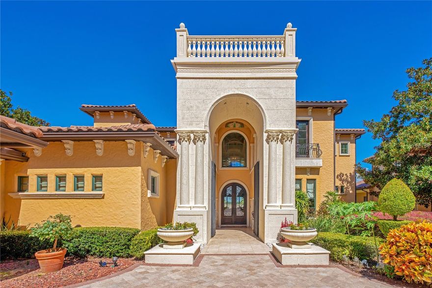 Nestled in the upscale Bella Collina community, VILLA ESPERANZA is the embodiment of grandeur and sophistication. Winner of STREET OF DREAMS, this extraordinary estate invites immediate occupancy and promises delight for its discerning new owner. From almost every room in the house, you'll be captivated by panoramic views of the stunning pool and shimmering Lake Sienna. As you enter, you're greeted by a volume foyer accentuated by exquisite faux paintings and hand-laid marble mosaics. The Living Room features one of two impressive stone fireplaces, both encased with masterful stonework. The Dining Room boasts an arched ceiling adorned with intricate brick overlays. The heart of this Tuscan-style masterpiece is the Dream Kitchen. It's equipped with granite countertops, a professional-grade Wolf gas stove, two dishwashers, a Sub-Zero Pro 48 refrigerator, and a sprawling 20 sq-ft granite-topped island with its own Sub-Zero refrigerator. In the Family Room, a hidden built-in bookcase reveals a 50" LED TV. The first-floor Master Bedroom suite sprawls over 2,500 sq ft and includes a private sitting room with a wet bar featuring a Subzero refrigerator. A see-through fireplace encased in stone adds to the allure. From here, you can gaze out over the spa and Lake Sienna. The Master Bath is equally impressive with his and hers vanities, two separate dressing areas, an 8-head double shower system, and a spacious Jacuzzi tub with an elegant iron canopy. The second floor offers four luxurious Master Suites, a Vegas-style game room, and a full bar overlooking the state-of-the-art theater and the serene lake beyond. The well-appointed theater features a Home Cinema HDR10, 4K wireless projector, and top luxury upholstered seating. Wood-framed accordion doors enhance the theater's acoustic isolation. Overlooking the lake, you'll find a series of balconies, and below, a generously sized heated pool, terrace, spa, and a summer kitchen with a Wolf gas fireplace and hood for culinary enthusiasts. This mansion is equipped with cutting-edge home automation systems, featuring a comprehensive Crestron automation system, Lutron Lighting System, and iQualink for effortless control of the pool via your cell phone. Every detail, from the exquisite woodwork to the stunning stonework and opulent marble, has been executed with unsurpassed craftsmanship. The home is turnkey, boasting essential and luxurious features, tasteful furnishings, imported luxury curtains, beautiful art, and notable pieces like hand-painted Italian artwork gracing the second-floor walls and arches. This is not just a home; it's a masterpiece, a sanctuary, and an opportunity you won't want to miss.