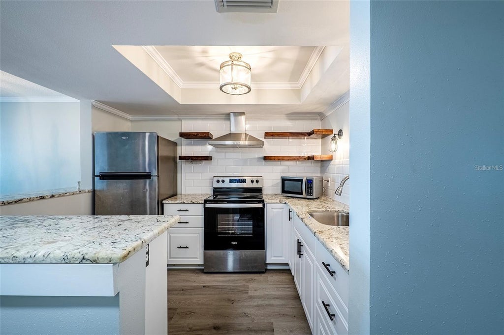 Photo of 620 Edgewater Drive #103, Dunedin, FL 34698 (MLS # TB8552154)