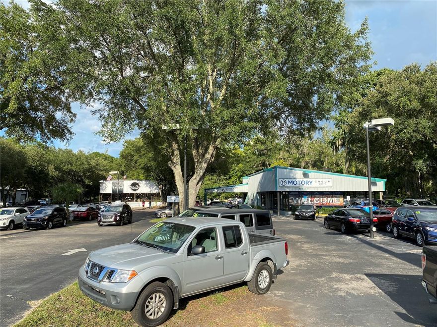 Main Street Frontage on auto row. Large acreage and fully leased to three tenants: two car dealerships and one service shop. Long storage garage roll ups behind one of the car dealership and service shop behind the other car dealership.