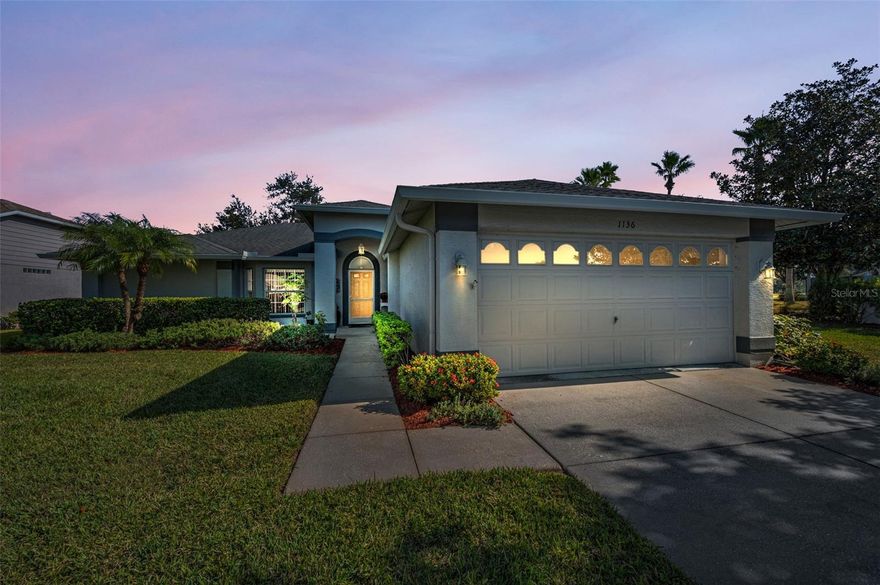 Just move right into this 3 bedrooms, 2 full bathrooms, Oversized 2 car garage! Once you arrive you will see the lush landscaping that brings you to the front door. As you enter into the foyer you have designer style laminate flooring & soaring vaulted ceilings in the formal living w/bay window and the formal dining room w/french doors to the enclosed lanai. The formal living & dining rooms are presently being used as a family room.  The kitchen has been updated w/cabinets that have pullout shelves, under cabinet lighting, tile backsplash, quartz counter tops w/breakfast bar, stainless steel appliances, closet pantry and a wonderful breakfast nook area. The kitchen overlooks the family room that has carpet and is presently being used as a dining room.  There is a hallway with two closets that lead you to the two guest bedrooms one w/carpet and the other is being used as home office w/laminate flooring. The guest bathroom has a tub w/shower and there is a pocket door that opens to the laundry room w/cabinets, closet, utility sink, washer & dryer.  The primary bedroom has plenty of room for all your pieces plus two walk-in closets.  The primary bathroom has been updated w/dual sinks and a walk-in shower.  The oversized garage has pull down staircase to attic and cabinets.  You and your guest will enjoy sitting in the enclosed lanai that has a fabulous view of the golf course. This gated community offers many events & activities that your social calendar will always be full! There is a golf course, tennis courts, pavilion w/picnic tables, bocce, shuffleboard, horseshoes, club house w/ restaurant & lounge, performing arts center, billiard & game room, arts & crafts room, library & computer room, heated pool & spa.