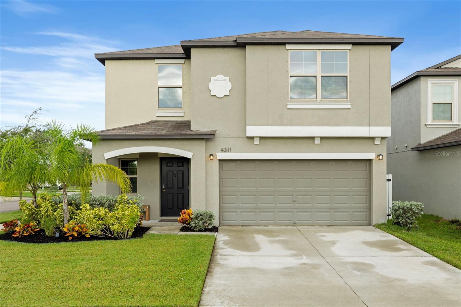 Welcome to this stunning corner-lot home on Romano Busciglio Street, offering 5 bedrooms (PLUS a loft!), 2.5 bathrooms, and 2,264 square feet of thoughtfully designed living space, maximizing every nook and cranny. This residence combines a bright, open floor plan with tasteful upgrades, making it truly move-in ready. Built in 2021, and located high and dry, with no flood insurance required and hurricane shutters that convey, this home is the epitome of easy maintenance and low stress.Â
Step inside to be greeted by abundant natural light, tiled and low-maintenance floors, a wide entry hallway, and a beautifully upgraded half bath featuring stylish wall paneling, fixtures, and modern paint colors. The spacious living room flows seamlessly into the dining area and upgraded kitchen, creating the perfect space for entertaining. The kitchen boasts open box shelving above the cabinets, drawing the eye upward and enhancing the sense of space, stainless steel appliances, a pantry, and a huge kitchen island overlooking the living space! The adjacent laundry room has been transformed with custom wall paneling, a folding station, and additional storage straight out of Pinterest inspiration.
Upstairs, a versatile loft offers additional living space, ideal for a media room, play area, or home office; There is even a custom-made undermount media center that conveys! The massive primary suite includes a walk-in closet and a spacious en-suite bathroom with dual sinks, a private water closet, a walk-in shower, and plenty of natural light. Four additional bedrooms and another full bathroom complete the second floor, each offering ample closet space with a layout that is perfection.Â
The completely vinyl-fenced backyard provides a private outdoor retreat, perfect for relaxing or entertaining with TWO tranquil pavered areas with plenty of room to enjoy outdoor seating or create your own backyard oasis. There is a double gate located on the north side of the fence, enabling the owners of the home to pull RVs, Boats, equipment, etc, through!Â
Located in a convenient Tampa neighborhood close to shopping, downtown, and highways, this home offers both space and style for modern living.