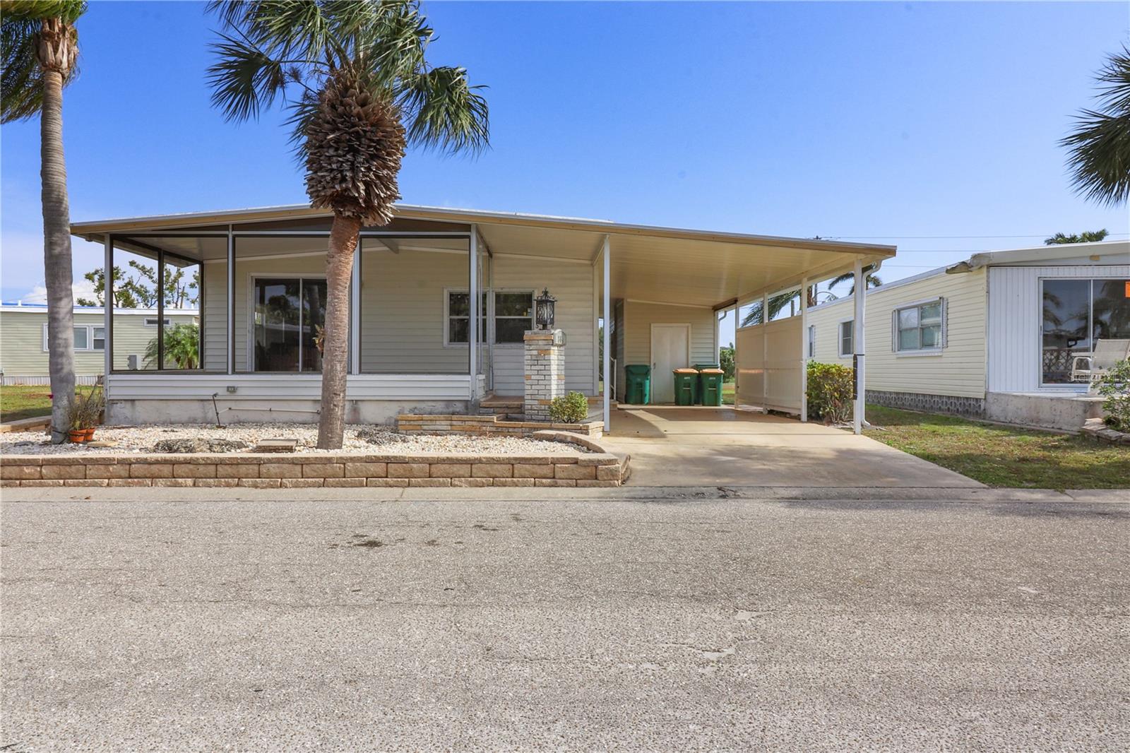 A great house at a great price! 2 bedroom/2 bath Jacobsen located on a pet friendly perimeter lot with a HUGE BACKYARD. You'll LOVE that this home has two sheds - one is 8 x 15 and also contains a wash sink and the other is smaller and contains the washer and dryer. The bedrooms are ample size and there are 2 full bathrooms (primary has a walk in shower and guest bath has a tub/shower). The only thing missing is the screening and door for the lanai but the frame and cover are still intact. Being sold "AS-IS" with rights to inspect. Sold partially furnished. Home price includes $40,000 certificate. Maple Leaf is a popular resident owned 55+ gated golf course community with an active resort lifestyle. Features an 18 hole, par 62 award winning golf course, 5 tennis courts, bocce ball, lawn bowling, 2 shuffleboard courts, 4 heated swimming pools, 2 hot tubs, fitness facility, woodworking facility, 75+ clubs/activities, 2 pickleball courts with 2 more being built, restaurants, tiki bar and much more. It is true what they say, it's all about the lifestyle in Maple Leaf! You can have one dog or one indoor cat only.