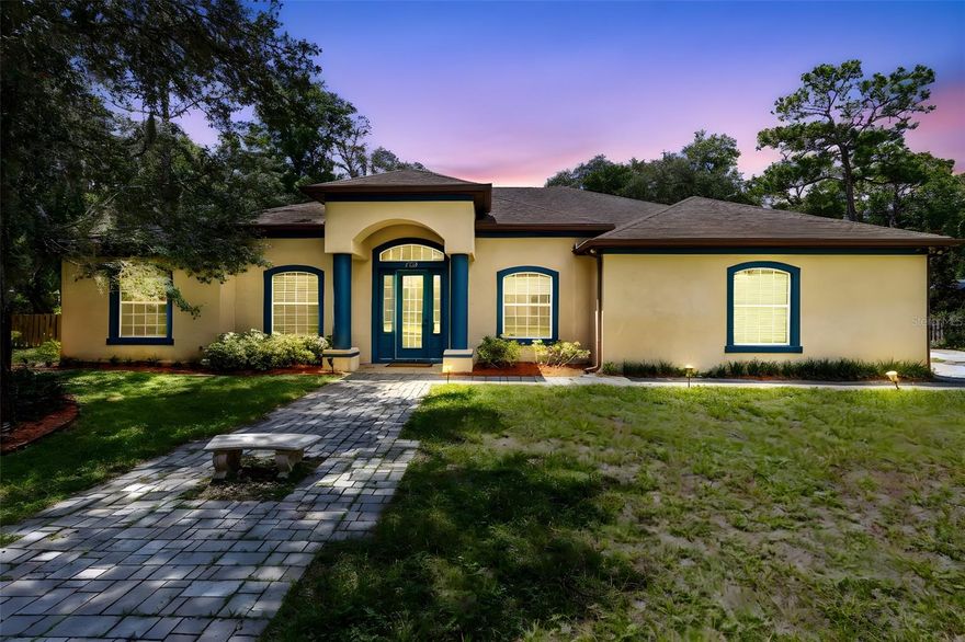 MULTIGENERATIONAL PROPERTY set on over 1/2 ACRE LOT with NO HOA!!! Beneath the shade of majestic oak trees, this 5-bedroom, 4-bathroom ONE STORY home combines classic charm with modern resort-style amenities. Step inside to find soaring 12-foot ceilings, expansive sunlit living spaces, and a split floor plan designed for both comfort and privacy. The primary suite feels like its own private sanctuary, complete with two walk-in closets, an oversized bedroom, and a spa-inspired bathroom featuring a jetted soaking tub and generous layout. Every bedroom offers 10-foot ceilings, creating a sense of openness throughout. Slide open the triple glass doors and step into your personal outdoor retreat: a screened-in patio spanning more than 400 sq. ft. with 12-foot ceilings, sparkling POOL & HOT TUB, and a fully equipped OUTDOOR KITCHEN with its own bathroom and shower—perfect for entertaining guests with ease. With NO HOA restrictions, you’ll have the freedom to enjoy this property however you wish. You can even convert the outdoor shed into an ADU or DETACHED MOTHER IN LAW SUITE! This home has endless opportunties to create a MULTIGENERATIONAL Property! Whether you’re sipping morning coffee under the oaks or hosting lively gatherings poolside, this home was built for both everyday comfort and memorable moments. All of this in a prime location close to shopping, dining, and TOP-RATED SCHOOLS! This home won't last long- schedule your showing today!