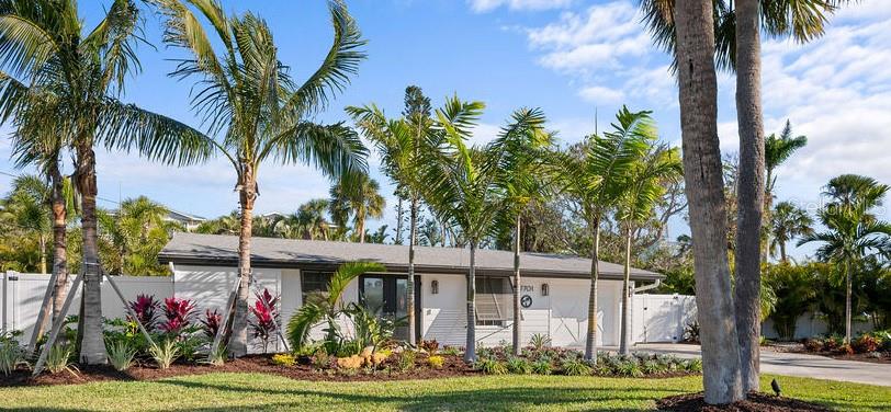 This is your ideal beach cottage that has been fully remodeled into a 3 bedroom/2 bath heated pool home with open floor plan! Only two blocks to the beach and allows short term rentals, this retreat is beautifully crafted for island living! It is a like-new home with ALL the upgrades! The practical marries the picture perfect with all the features of this home that you have to see to believe! It has the quartz countertops, tile backsplash, Big Chill appliances, under cabinet LED lighting, Luxury Vinyl Plank flooring, custom window treatments, California Closet Organizers, Dry Bar with Zephyr wine cooler, Waterstone Nautical Wheel faucet, all new furnishings, a garage with new insulated door and epoxy floor, all new landscaping, all new exterior lighting and irrigation, all new insulated windows and doors, fully updated 200 electrical service, Bard A/C unit with Honeywell T-6 Thermostat, Puronics full house water purifier, and the heated pool with Omni Logic Controller, to name a few! All of this is ONLY 2 blocks to the beach with fantastic rental potential! There is nothing to do but drop your bags, relax and enjoy!