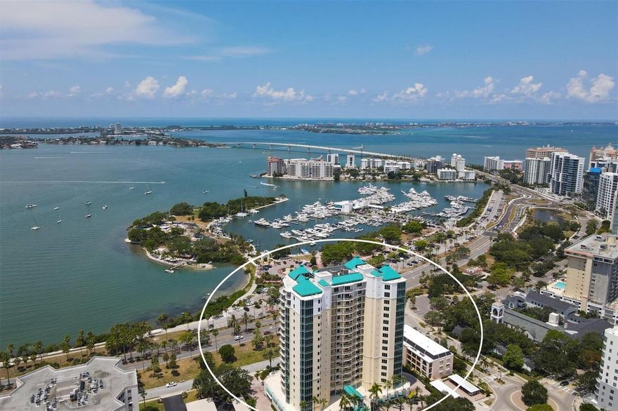 Experience exquisite Bay views from one of downtown Sarasota's most coveted residences. Sarabande, located on scenic Palm Avenue directly across from the bayfront and marina, offers luxury and comfort with the perks of living downtown Sarasota. Situated on the 8th level, in the center of the building, this condominium boasts one of the largest terraces, perfect for entertainting. Floor-to-ceiling windows enhance the spaciousness of the residence while bathing the well-appointed interior with natural light, highlighting the gorgeous new porcelain tile flooring. The kitchen is a masterpiece of modernity, adorned with sleek stainless-steel appliances and new quartz countertops. Enjoy looking out over the water as you create culinary delights. The third bedroom was converted to a den that opens to the living room and features water views. The roomy owner's suite includes 3 walk-in closets and an updated en-suite bathroom featuring contemporary white cabinetry, quartz countertops, an expansive walk-in shower, double sinks, and ample storage. The east-facing private terrace, accessed via the owner's suite and the second bedroom, offers panoramic city views and beautiful sunrises. Sarabande is a testament to refined living and includes state-of-the-art amenities such as a 24-hour concierge, 2 pools, a spa, fitness center, massage room, steam room, 2 guest suites, club room with catering kitchen, library and wine storage. One parking space and storage are also included. The theater district, restaurants and shops are a short stroll away while white-sand beaches, St. Armands Circle and the airport are within easy driving distance.