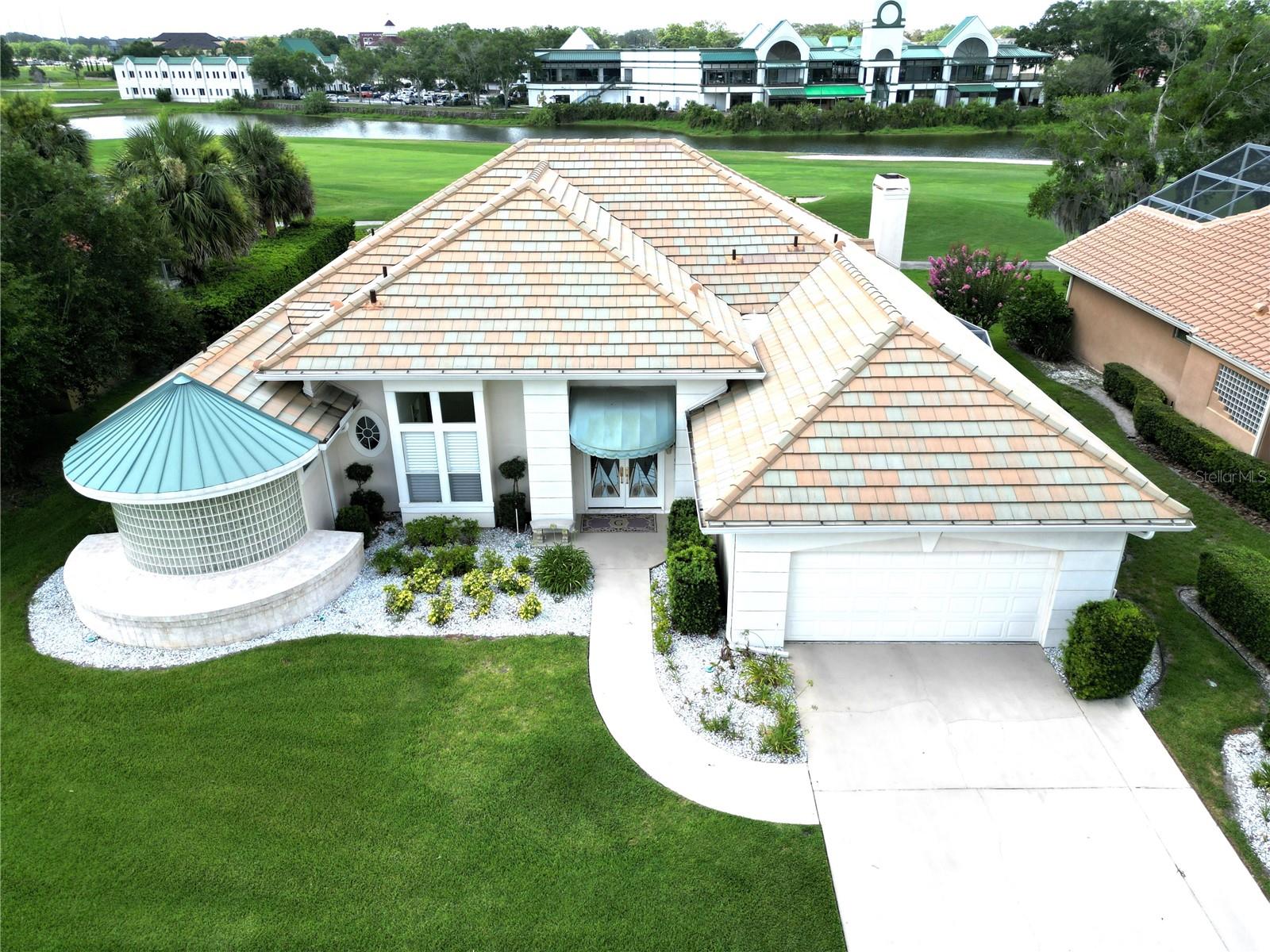 $10,000 below appraisal! Spectacular view of the 7th hole and water on Heathrow golf course! Custom built with unique open floor plan. Marble floored entry leads to large living room featuring a built-in bar with cabinet storage. Formal dining room with rounded walls overlooks screened pool. Eat-in kitchen has ample cabinets with pull out shelving, tile counters and breakfast nook. Cozy family room has stone fireplace and built-ins. Primary suite is a WOW with a 15x10 sitting area, built-in cabinets and two large walk-in closets. One closet has a unique carousel for extra hanging items. Primary bath features marble floors & counters, jetted tub and large shower. Access from primary bedroom to 4th bedroom which could serve as an office. On opposite side of house are two bedrooms and third bath. Fourth bathroom is on lanai to service the pool. Plantation shutters throughout add to the charm of this one owner home. Screened lanai and pool with updated tile, new pool pump and additional exterior sundeck. Heathrow offers parks, fishing pier and playing field, short distance to major highway and shopping. Only 55 minutes to the beach and 45 minutes to the attractions. Perfect location! One year home warranty.