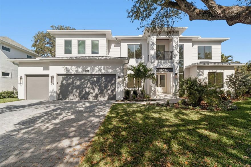 This gorgeous, newly completed new construction offers quality craftsmanship and immediate move-in readiness. Luxury and lifestyle converge on a rare 13,000+ square foot lot in the heart of Sunset Park—one of South Tampa’s most coveted neighborhoods. This two-story residence is thoughtfully designed for refined family living, offering 5 bedrooms, 5 full bathrooms, a powder bath, private office, formal dining room, media and game rooms, and dual laundry rooms. A dramatic 22-foot foyer sets the tone, opening to an expansive great room with coffered ceilings and a chef’s kitchen equipped with Thermador appliances, a waterfall-edge island, custom cabinetry, and a walk-in butler’s pantry. Built with quality, resilience, and comfort in mind, the home features impact-rated windows and doors for peace of mind, along with Icynene open-cell spray foam insulation in the attic and between floors for superior energy efficiency and sound dampening. The flexible floor plan includes a downstairs guest suite and media room, with sliding glass doors that lead to a resort-style backyard complete with a saltwater pool and spa, full outdoor kitchen, covered lanai, gas fireplace, and additional green space ideal for play or entertaining. Upstairs, you’ll find three en-suite bedrooms, a media/playroom, and a luxurious owner’s retreat featuring dual walk-in closets and a spa-inspired bath with a freestanding soaking tub, oversized dual vanity, glass-enclosed shower, and abundant natural light. Centrally located just minutes from Tampa International Airport, top-rated schools, upscale shopping, award-winning restaurants, and Tampa Bay’s beaches—come see why this home is so special, tucked away on a quiet street in one of South Tampa’s premier neighborhoods. Please refer to the attached floor plans.