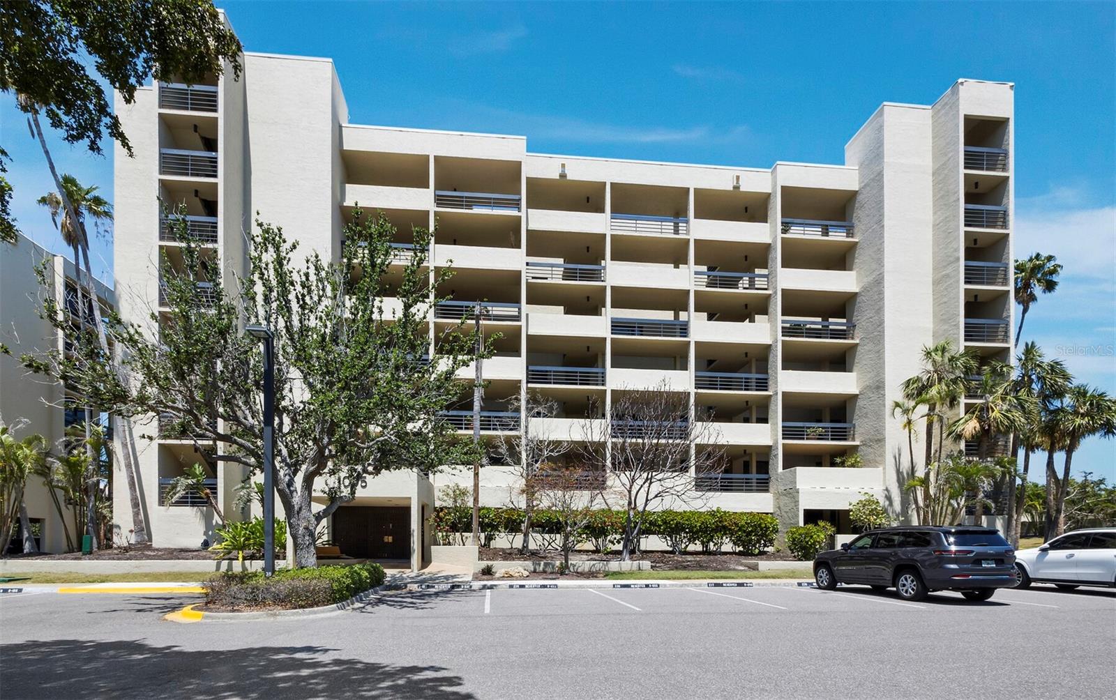 Enjoy comfortable, coastal living in this well-appointed 2BR/2BA residence on the sought-after south end of Longboat Key. With over 1,500 sq. ft., this home features a neutral color palette and thoughtful design that enhances the natural beauty just outside. The kitchen offers classic white cabinetry with glass accents, granite countertops, stainless-steel appliances, and recessed lighting. A breakfast bar opens to the dining area, which flows into the spacious living room. Large sliding glass doors lead to the terrace, offering views of Sarasota Bay, the peaceful community lake and fountain, and the Gulf of Mexico - perfect for watching sunsets. The primary suite is light and airy, with terrace access and a full wall of glass. The en suite bath includes dual vanities, a walk-in shower, and a separate water closet. The guest suite also features generous space, plenty of storage, and its own full bath. Beachplace is a 31-acre gated community known for its mid-century modern design by Tim Seibert and its outstanding amenities: private beach access, a Jr. Olympic-sized pool, spa, kiddie pool, clubhouse with social activities, two fitness centers, sauna, tennis and pickleball courts, EV charging, and grilling stations. Rentals are allowed 12 times per year with a 30-day minimum. Residents also enjoy proximity to the prestigious Longboat Key Club, offering an exceptional lifestyle with 45 holes of championship golf, a world-class tennis center, a full-service marina, spa and wellness center, fine dining, and a private beach club - making it easy to enjoy the best of resort-style living just moments from home.