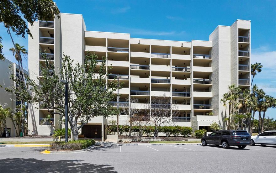One or more photo(s) has been virtually staged. Enjoy comfortable, coastal living in this well-appointed 2BR/2BA residence on the sought-after south end of Longboat Key. With over 1,500 sq. ft., this home features a neutral color palette and thoughtful design that enhances the natural beauty just outside. The kitchen offers classic white cabinetry with glass accents, granite countertops, stainless-steel appliances, and recessed lighting. A breakfast bar opens to the dining area, which flows into the spacious living room. Large sliding glass doors lead to the terrace, offering views of Sarasota Bay, the peaceful community lake and fountain, and the Gulf of Mexico - perfect for watching sunsets. The primary suite is light and airy, with terrace access and a full wall of glass. The en suite bath includes dual vanities, a walk-in shower, and a separate water closet. The guest suite also features generous space, plenty of storage, and its own full bath. Beachplace is a 31-acre gated community known for its mid-century modern design by Tim Seibert and its outstanding amenities: private beach access, a Jr. Olympic-sized pool, spa, kiddie pool, clubhouse with social activities, two fitness centers, sauna, tennis and pickleball courts, EV charging, and grilling stations. Rentals are allowed 12 times per year with a 30-day minimum. Residents also enjoy proximity to the prestigious Longboat Key Club, offering an exceptional lifestyle with 45 holes of championship golf, a world-class tennis center, a full-service marina, spa and wellness center, fine dining, and a private beach club - making it easy to enjoy the best of resort-style living just moments from home.