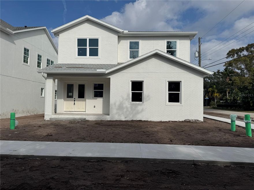 Set on an expansive 50x148 corner lot, this impressive new construction home offers 3,231 square feet of refined living space. From the moment you enter the double front doors, you’re greeted by abundant natural light, white oak flooring, and elevated finishes that immediately make you feel at home. The thoughtfully designed floor plan features a spacious great room, eat-in kitchen, large pantry, and powder bath. A gourmet kitchen is truly the centerpiece of the home, showcasing an oversized White Rhino Dolomite island, stainless steel appliances, and striking Zellige tile, making it ideal for entertaining and daily life. Upstairs, the luxurious primary suite offers a generous walk-in closet and a spa-inspired en-suite bathroom complete with double vanities, a soaking tub, and an oversized walk-in shower. Three additional bedrooms, two full bathrooms, and a spacious bonus/flex area provide ample room to relax, work, or unwind. Located minutes from Bayshore Blvd, Downtown Tampa, MacDill AFB, and our beautiful beaches, this home has it all!