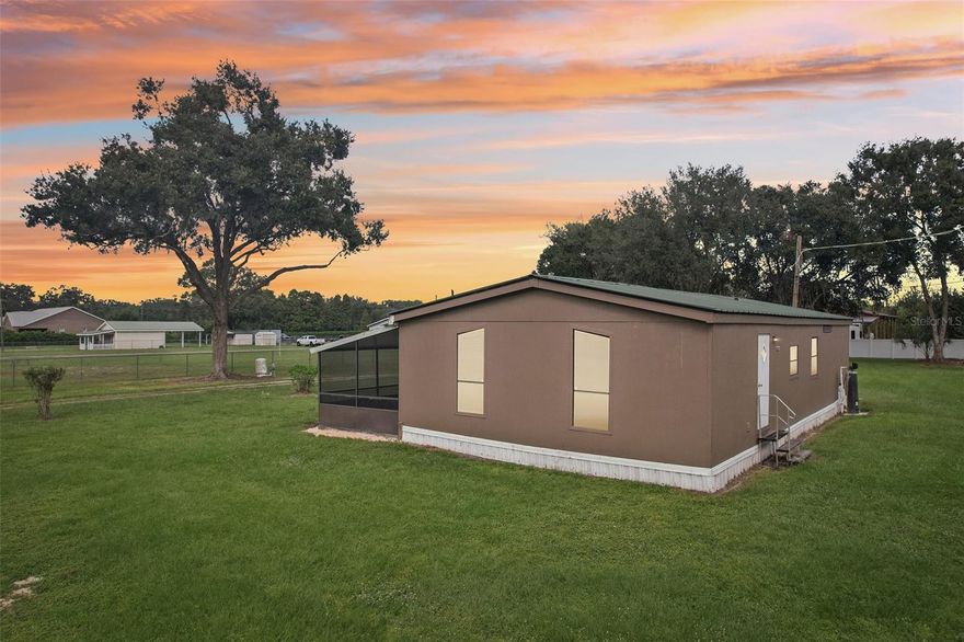 Country Living City Conveniences! Welcome to this cozy and well-maintained manufactured home on nearly 1 acre in the peaceful countryside of Plant City. This 3-bedroom, 2-bath residence offers 1,196 sq ft of living space and sits on a 0.91-acre lot. 




 The home is equipped with central cooling and features a full bath off the primary bedroom plus a second full bath. 


Exterior & Lot
The property is zoned AS-1. 

 The exterior is clad in wood siding and the roof is metal, giving it a rustic yet durable character. 




 The spacious yard offers room for landscaping, gardening, or perhaps a workshop or outdoor living enhancements.

Highlights & Opportunities

No HOA (based on surrounding area norms)

Ideal for someone seeking a balance between country living and proximity to city conveniences

Room to expand, personalize, or add outbuildings

Good for first-time buyers, investors, or downsizers