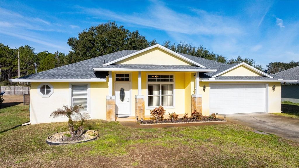 Photo of 13 Brownstone Lane, Palm Coast, FL 32137 (MLS # O6376074)
