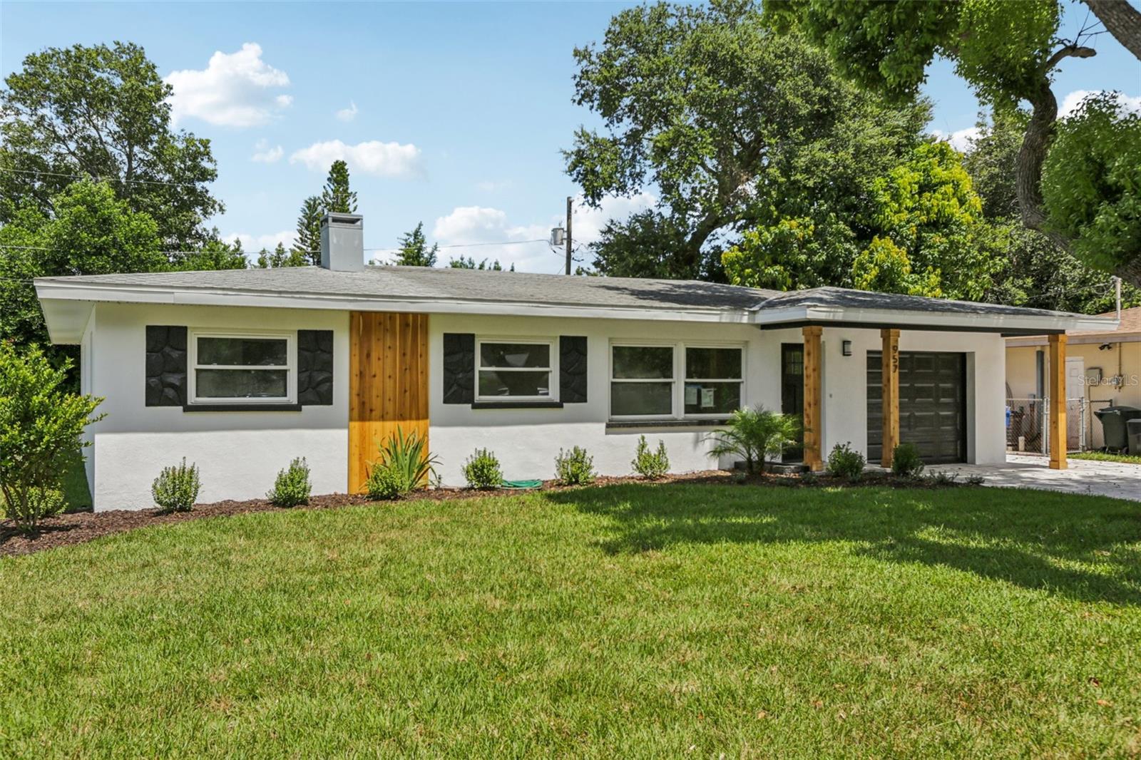 COMPLETELY RENOVATED – NON-FLOOD ZONE!
Welcome to this beautifully renovated 3-bedroom, 2-bathroom home located in the heart of Dunedin, Florida. Offering 1,672 square feet of living space, this property blends modern luxury with everyday practicality—situated on high and dry land, outside of a flood zone, and untouched by hurricane or storm damage. With no HOA, a one-car garage, ample street parking, and a brand-new paver driveway, convenience is built right in. This home is also nestled in a golf cart-friendly neighborhood, adding to the charm and accessibility of the Dunedin lifestyle. Inside, you’ll be greeted by a fully updated interior featuring luxury LVP flooring throughout, hurricane-impact windows and doors, and a bright, open layout perfect for entertaining. The kitchen is a standout, showcasing white shaker cabinets, white quartz countertops, a tile backsplash, a deep stainless steel farmhouse sink, a microwave drawer, a stainless steel range hood, and brand-new stainless steel appliances—a dream for any home chef. Both bathrooms have been tastefully remodeled with sleek LED anti-fog mirrors and modern finishes, while the home also includes an air-conditioned laundry room for added convenience. Step outside to enjoy the completely resodded yard, luxury landscaping, and a new sprinkler system that ensures year-round curb appeal. Whether you’re hosting friends or just enjoying a quiet Florida evening, this outdoor space is ready to impress. All of this is located just minutes from downtown Dunedin, offering quick access to award-winning beaches, vibrant restaurants and breweries, charming boutiques, top-rated medical facilities, and the scenic Pinellas Trail. Whether you’re looking for a full-time residence or a seasonal retreat, this move-in-ready home delivers comfort, convenience, and quality in one of the area’s most sought-after communities.
