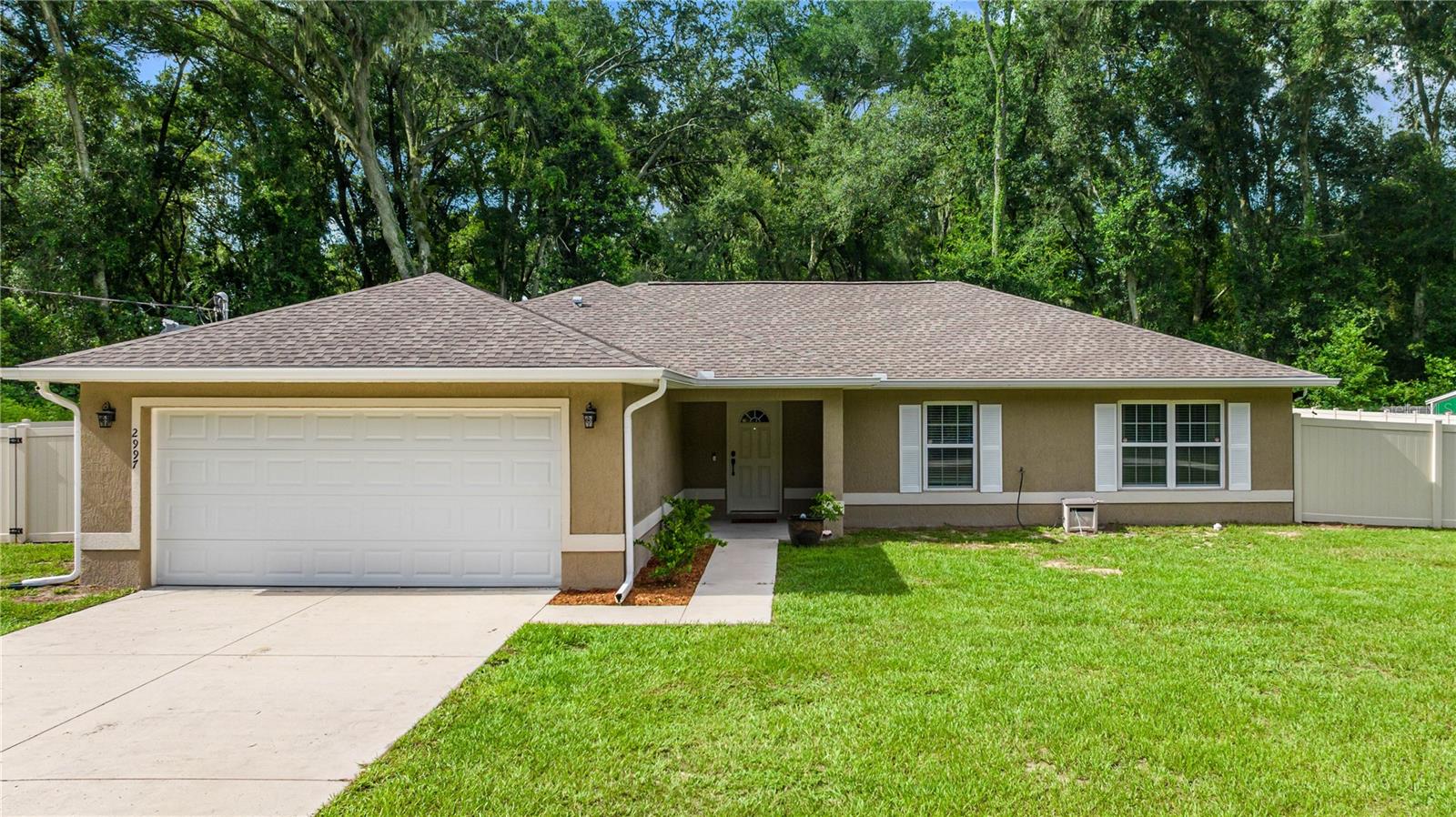 **Beautiful 2020-built home in Summerfield!** This spacious 4-bedroom, 2-bath split floor plan offers modern living with LVP flooring throughout—no carpet! Enjoy an open-concept layout perfect for entertaining, plus a fully fenced front and backyard—ideal for pets, play, or privacy. The kitchen offers plenty of storage and counter space, and the home is USDA eligible, making it a great opportunity for qualified buyers. Conveniently located near shopping, dining, and just minutes to The Villages, Ocala, and Belleview.