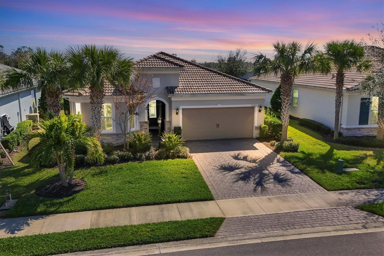 One or more photo(s) has been virtually staged. Huge Price Drop! Now listed at $649,900—unmatched value in Mallory Park with private pool and water views!
Welcome to 12326 Blue Hill Trail, a meticulously maintained and move-in-ready gem in one of Lakewood Ranch’s most sought-after gated communities. This 3-bedroom, 2.5-bath home with a private office and 2-car garage offers both thoughtful upgrades and everyday comfort.
Step inside to an airy, open layout with guest rooms at the front and a tranquil owner’s suite privately tucked in the back—complete with peaceful pond views. The light-filled living area features an upgraded electrical outlet for added convenience, plus a built-in internet booster near the owner’s suite for enhanced connectivity.
The gourmet kitchen boasts granite countertops, a smart and functional layout, and a custom Shelf Genie pantry system. Throughout the home, you’ll find hurricane-impact windows and doors, motorized Hunter Douglas window treatments, and a whole-home Kinetico water filtration system. The garage offers additional square footage for extra storage or hobby space.
Out back, enjoy a heated saltwater pool overlooking the water—a serene setting for relaxing, entertaining, or enjoying Florida sunsets.
Located in amenity-rich Mallory Park with low HOA fees and A-rated schools, this is one of the best-priced homes in the neighborhood. Don’t wait—this one is priced to move.