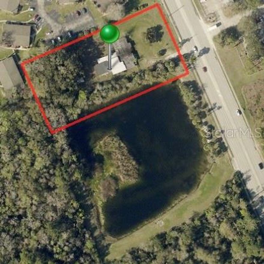 Property is located on Mission Dr  across the street from the Regional Post Office. Almost 2 acres where the southside of the property backs up to a lake.  Ideal set-up for multi-housing, apartments or condos.  Walk to stores and restaurants.