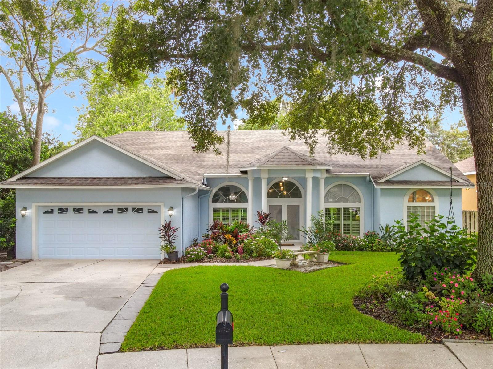 Welcome to the luxurious Florida Casual lifestyle. Discover this Gorgeously remodeled 4 Bedroom, 2.5 Bath Pool Home that will delight and inspire you as it captures the perfect balance of luxury and comfort. Flowering Shrubs and mature landscaping set the tone as you step across the threshold, where soaring 12-foot ceilings crown formal Living and Dining spaces overlooking the pool, and a spacious Family Room takes your breath away with stunning pond views. Fall in love with your Dream Chef’s kitchen featuring quartz countertops, a center island, premium appliances including GE Café induction range with air-fryer & convection double oven, ultra quiet Bosch dishwasher, and LG refrigerator, AND a massive 10-foot walk-in pantry, plus a charming breakfast nook overlooking the Spacious Family Room with custom entertainment center, and new windows to take in the view. Through French doors, discover your own slice of paradise - an extended covered lanai, sparkling pool and spa, and beautifully landscaped yard with a serene view of the neighborhood pond and lighted fountain. Whether it’s sunny afternoons or starry nights, this outdoor retreat is made for relaxation and entertaining. The Primary suite is a true sanctuary. Beyond a private office with a custom built-in closet, you’ll find a spacious Primary Suite with sitting area, two walk-in closets—including a chic and glamourous dressing closet stretching 15 feet—and a spa-like ensuite bathroom featuring dual vanities, a free standing soaking tub, and an expansive walk-in shower. On the opposite side of the home, two large bedrooms and a full bath with tub/shower offer privacy and comfort for family or guests. A half bath is conveniently accessed from the pool deck. This home has been comprehensively updated for peace of mind and modern living including: New Roof (2019), New Windows (2024), New Re-Pipe (2019), New Water Heater (2025), New Kitchen (2021) New Bathrooms (2024), New Mohawk Luxury Vinyl Plank flooring throughout (2023), fresh paint inside and out, and New pool Heat Pump with variable-speed pool pump (2021). Added conveniences include a Tesla EV charger (2024) compatible with all EVs, programmable thermostat, and a New 8x10 shed. Nestled in the quiet Twin Oaks neighborhood with A-rated schools and just steps from the Cross Seminole Trail for walking, running, or biking—this home offers more than just luxury. It’s the essence of Florida Casual living at its Finest.