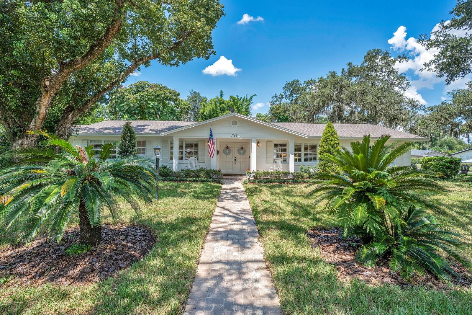 This Is It – The Dommerich Gem You've Been Waiting For! Nestled on a beautiful corner lot in one of Maitland's most desirable neighborhoods, this completely renovated 4-bedroom, 3.5-bath pool home is truly a showstopper! From the moment you enter the foyer, you’ll be captivated by gorgeous hardwood floors, plantation shutters throughout, and an abundance of natural light that fills every corner of the home. The open-concept layout is perfect for every day living, featuring custom built-ins and a welcoming family room that flows seamlessly into a cozy bench-style dining area. The heart of the home is the chef-inspired kitchen, boasting a large island with seating for six, gas range, farmhouse sink, ample storage with a built-in desk space. Adjacent to the kitchen is a flexible formal living space—ideal for a home office, playroom, or second entertainment area. Step outside to your private backyard oasis, complete with a covered porch with tongue-and-groove ceilings, sparkling pool, lush tropical landscaping, and your very own putting green! Inside, two secondary bedrooms share a full bath, while a third features a private ensuite that was added during the renovation. The primary suite is a retreat in itself, offering dual custom closets, French doors leading to the backyard, and a luxurious bathroom with a massive marble shower, freestanding soaking tub, and double vanities. As a bonus, a small, climate-controlled office space was added in the garage—perfect for working from home. Located in the heart of Dommerich, you’re just minutes from Park Avenue’s renowned shopping and dining, top-rated schools, and everything that makes this community so special. Don’t miss this rare opportunity to make this home yours!